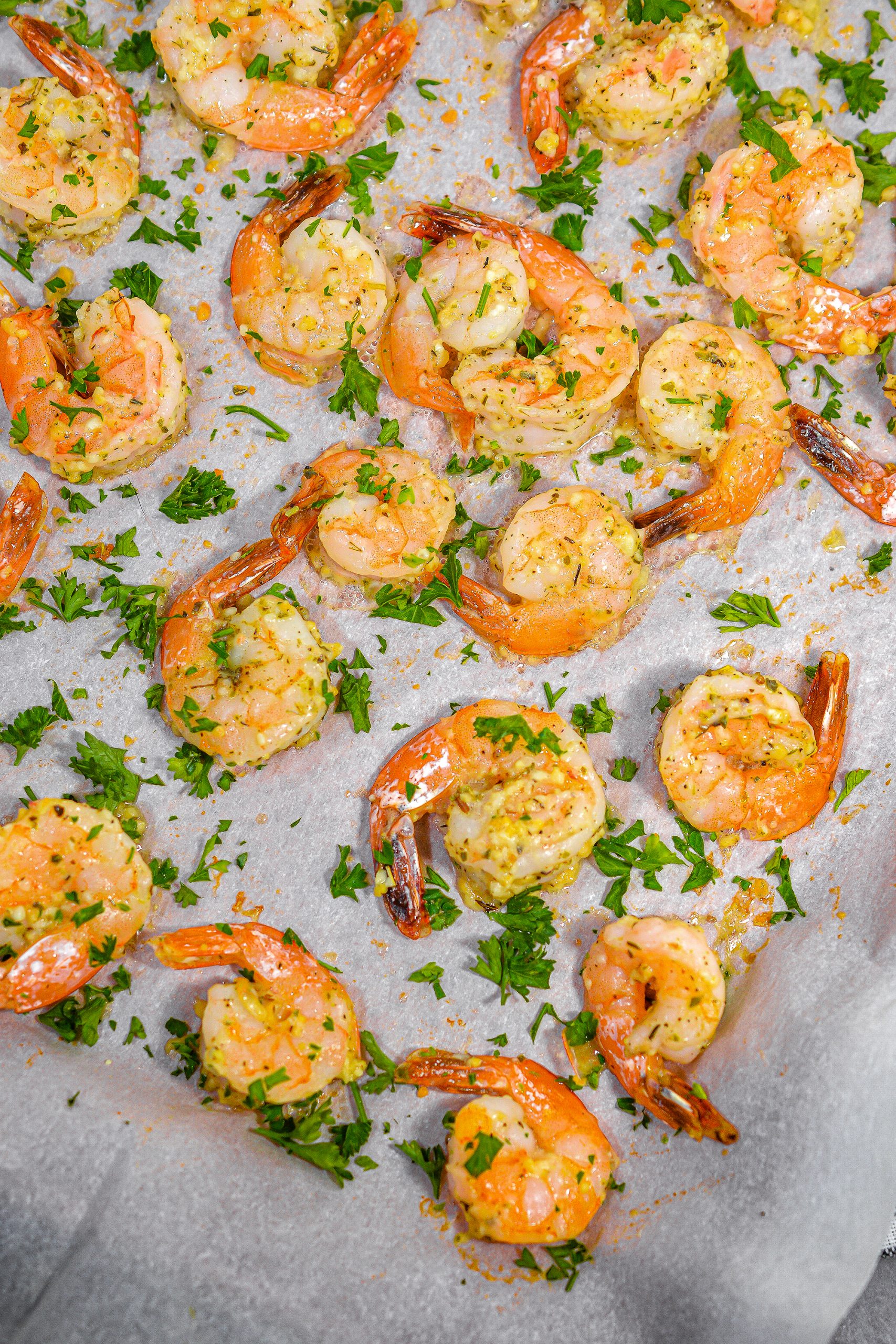 Squeeze fresh lemon juice to taste over the shrimp, and garnish with parsley before serving.