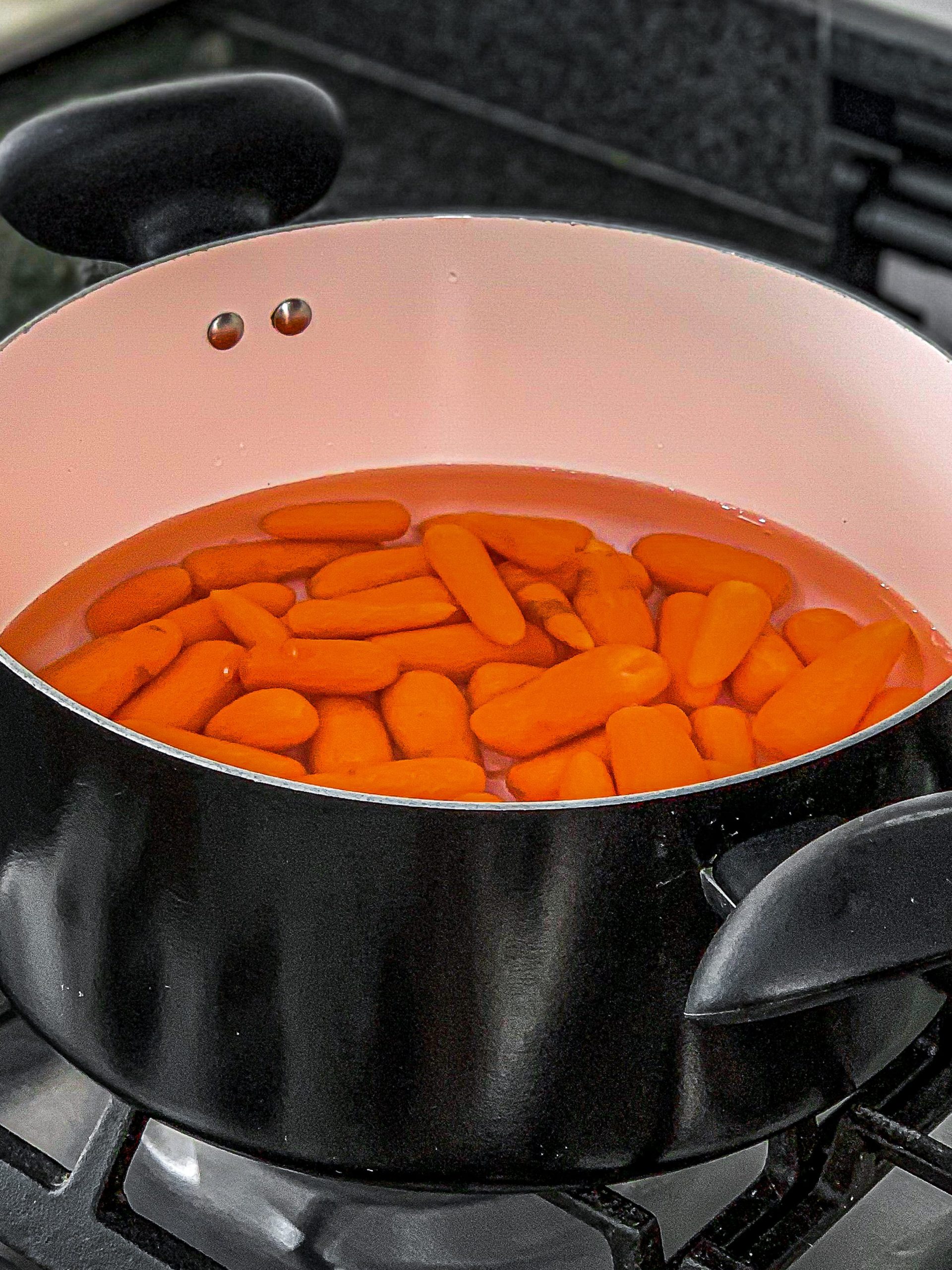 Add the carrots in a large saucepan over medium heat with 1-inch-deep water. Bring it to a boil.