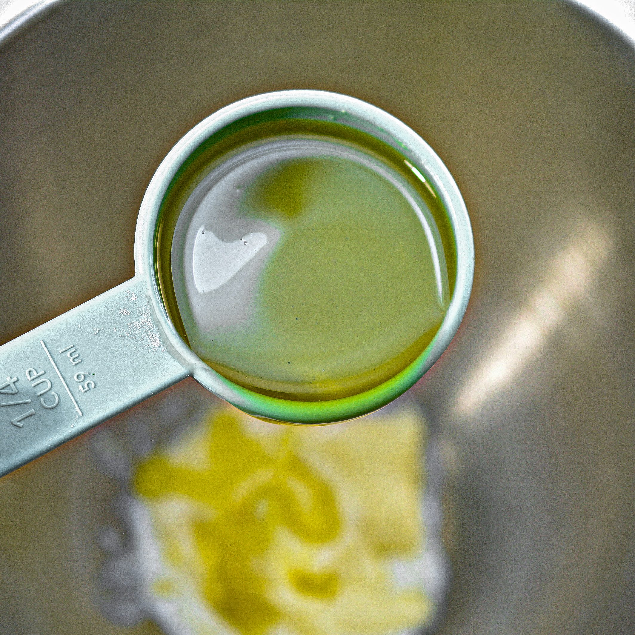 In a mixing bowl, beat together the butter, oil, and sugars until well combined and fluffy.