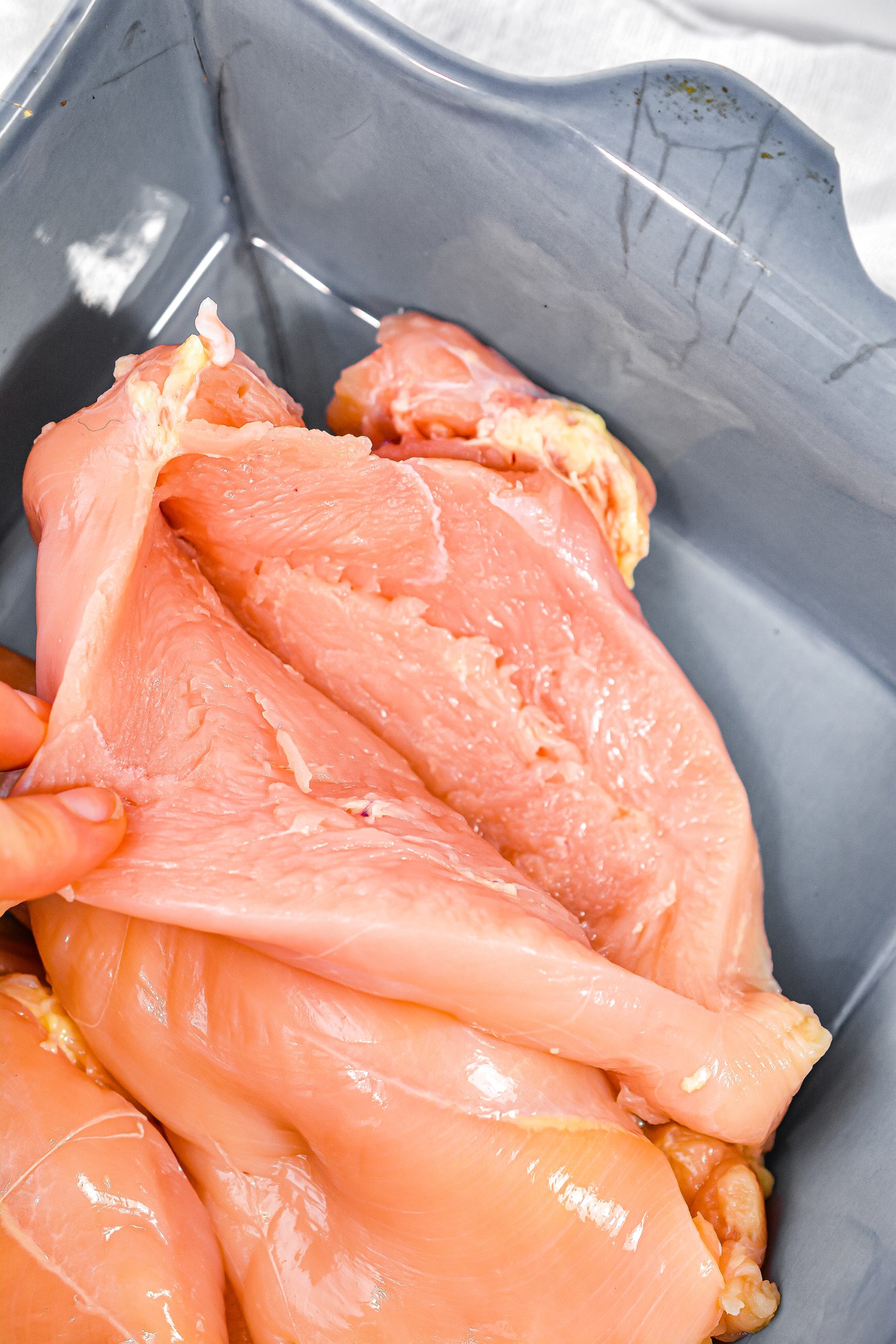 Cut a slit in the side of each chicken breast so that it forms a pocket that you can stuff.
