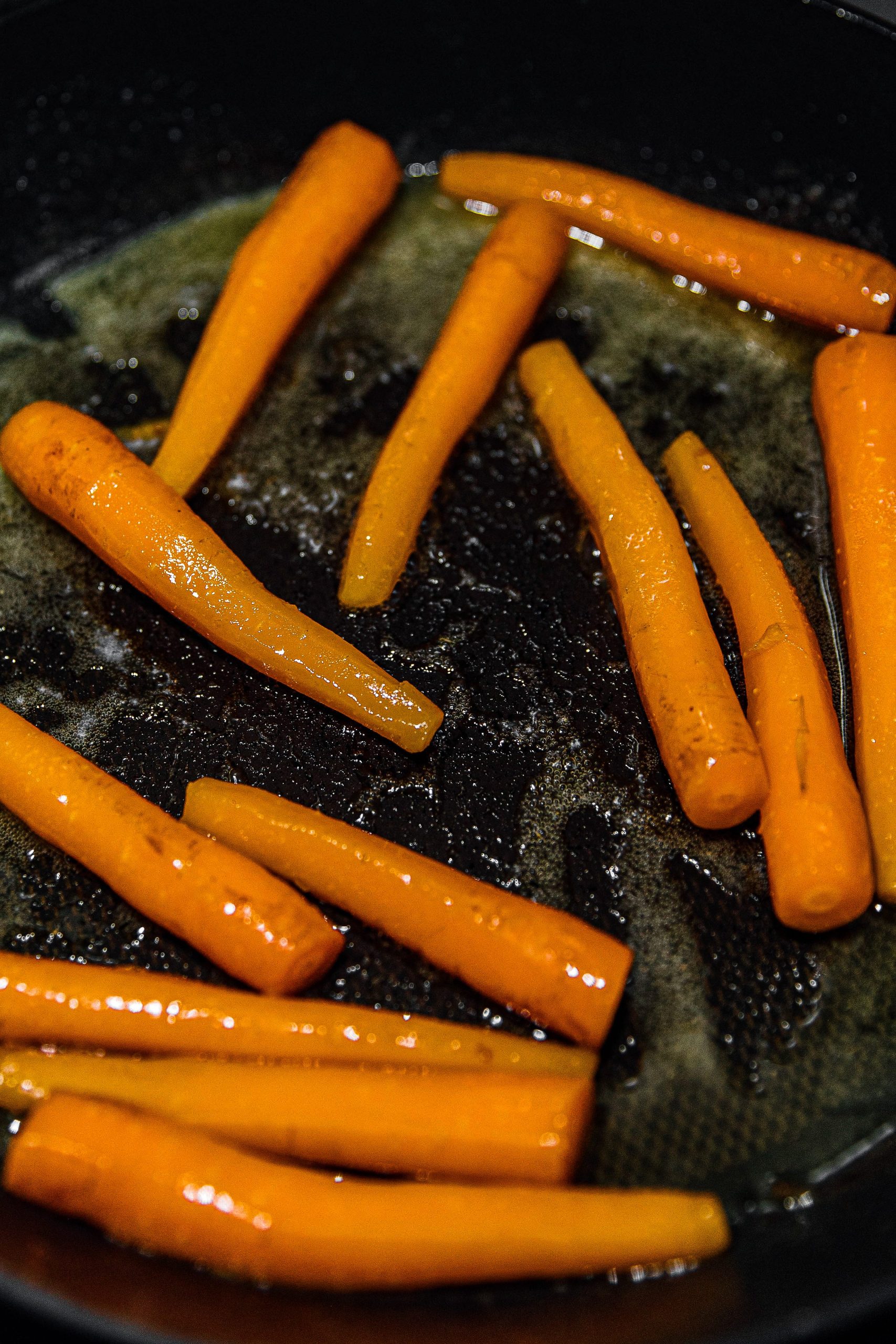 Add carrots to the skillet, stirring to coat in sauce. Cook for a few minutes, then serve immediately.