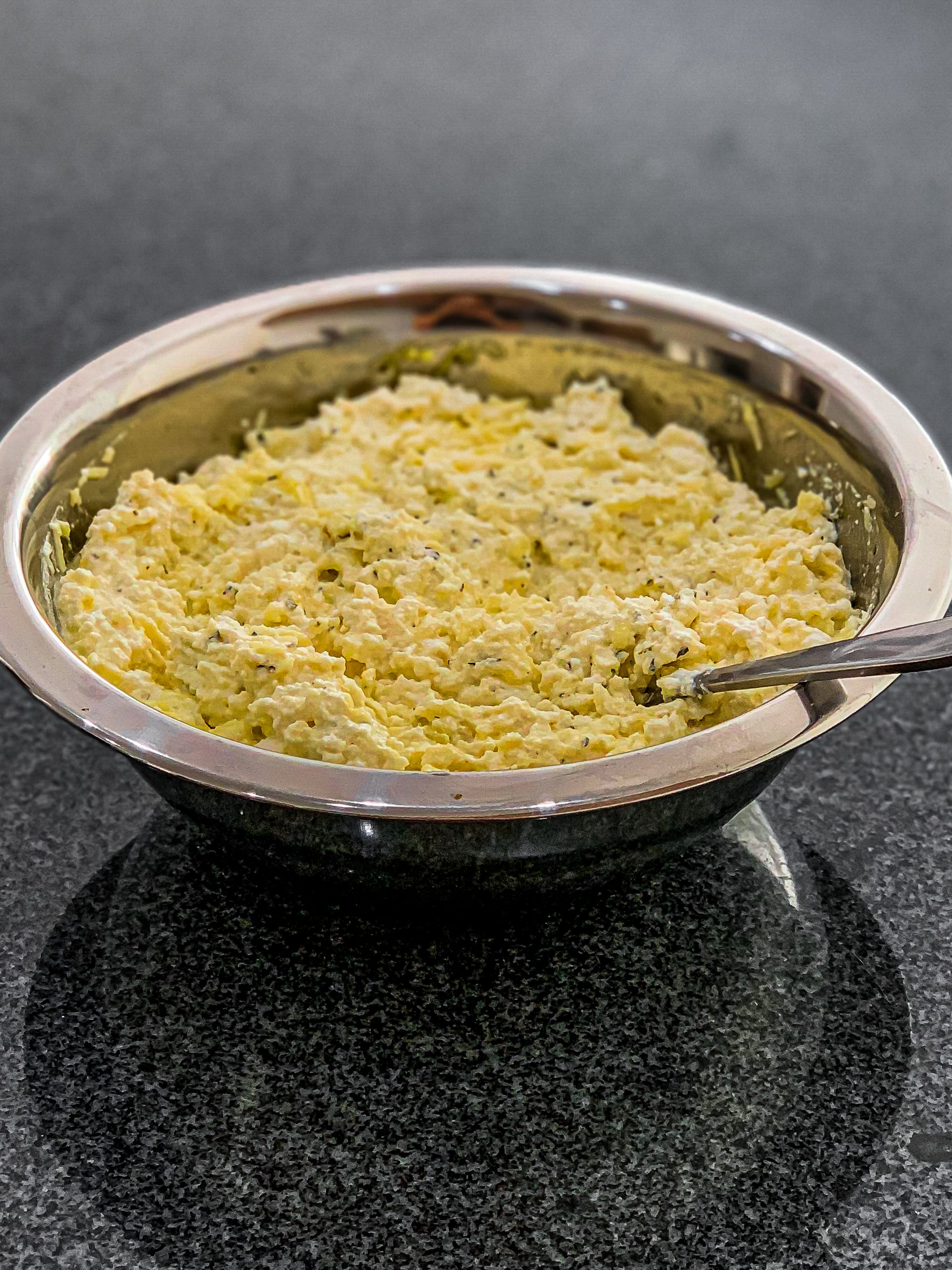 In a separate bowl, mix the ricotta cheese with an egg, mozzarella cheese, 1 teaspoon Italian seasoning, and parmesan cheese.