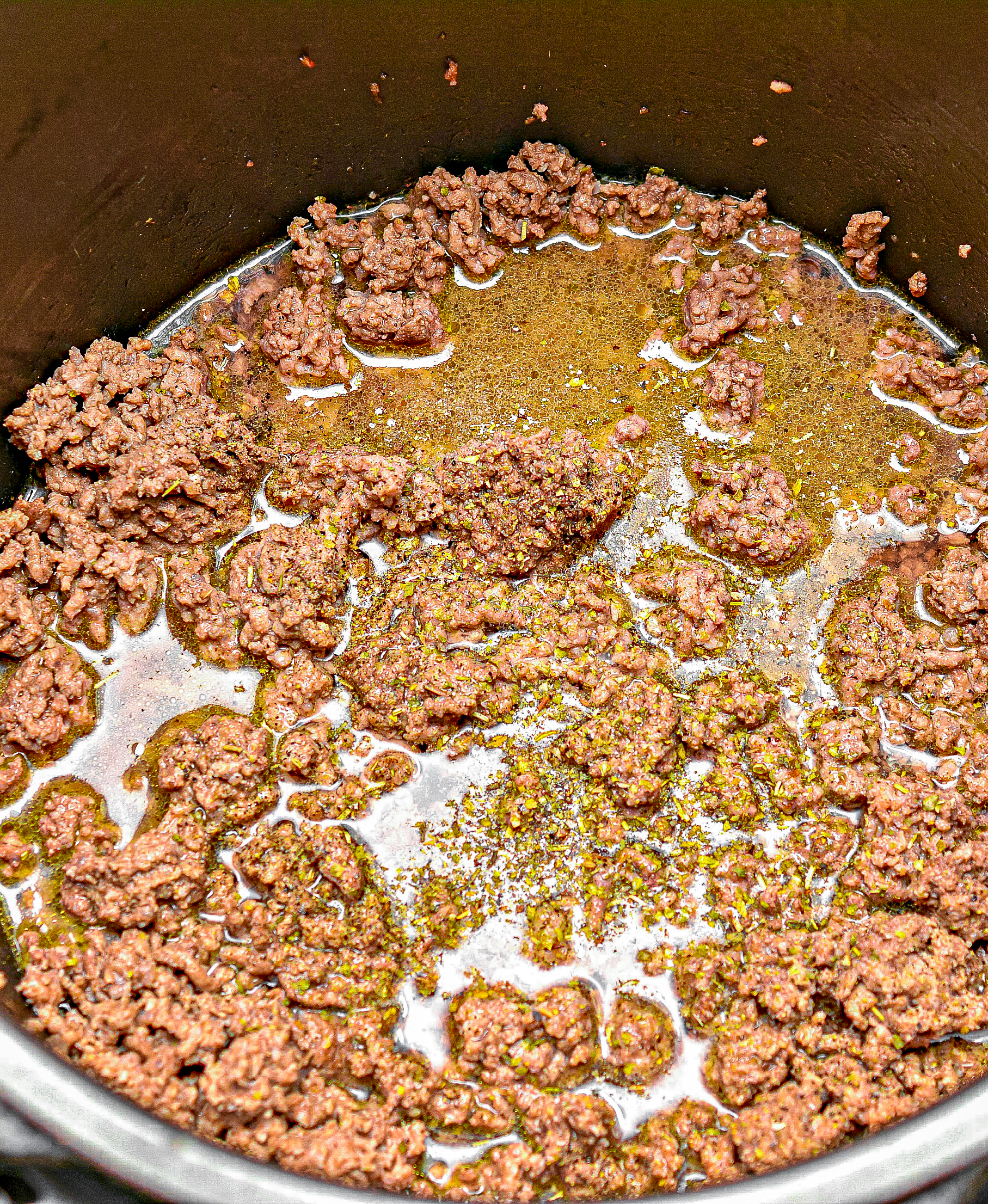 Set the Instant Pot to saute, and saute the ground beef until completely browned, and then drain thoroughly.