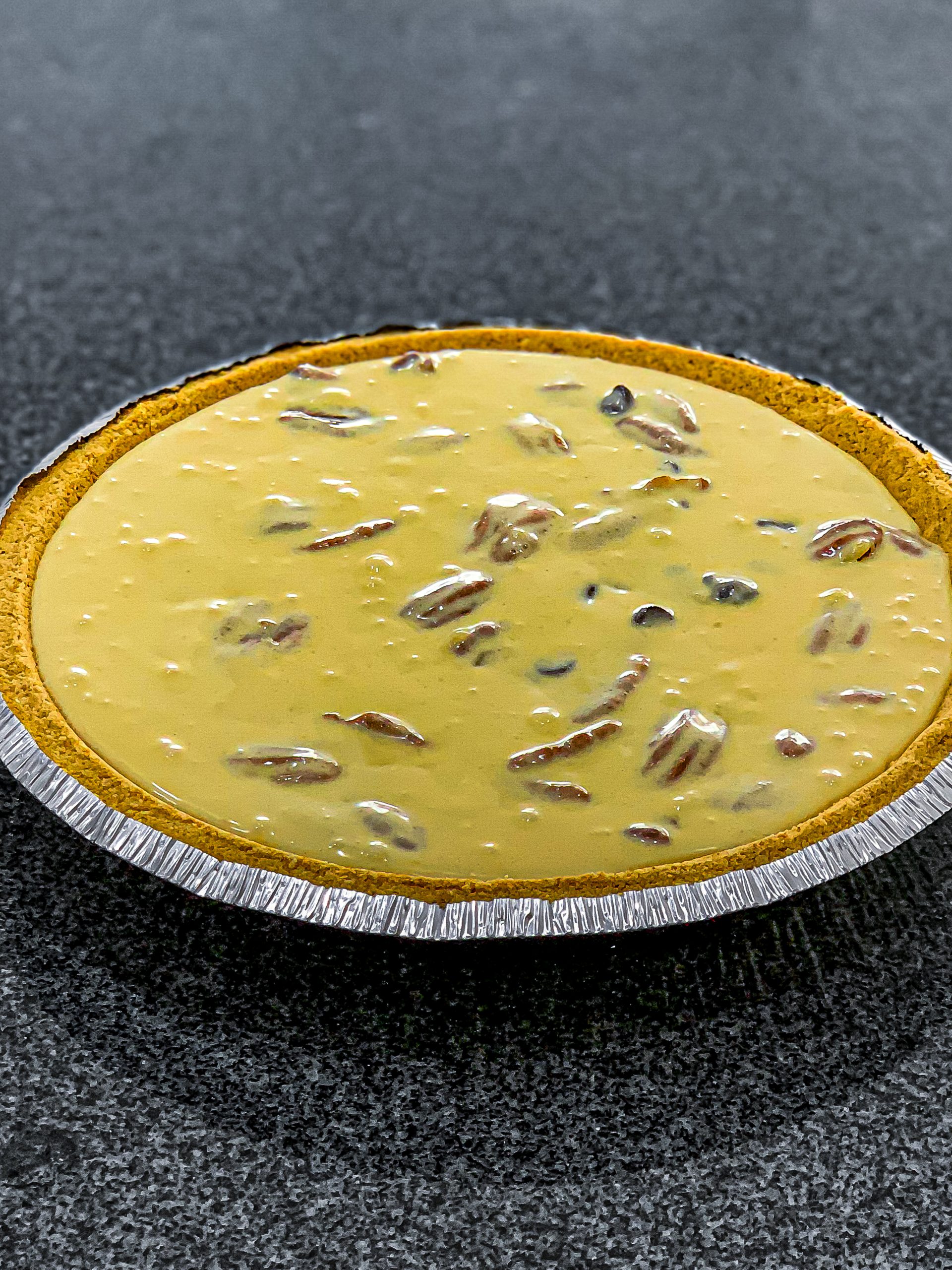 Pour the mixture into the unbaked pie shell.