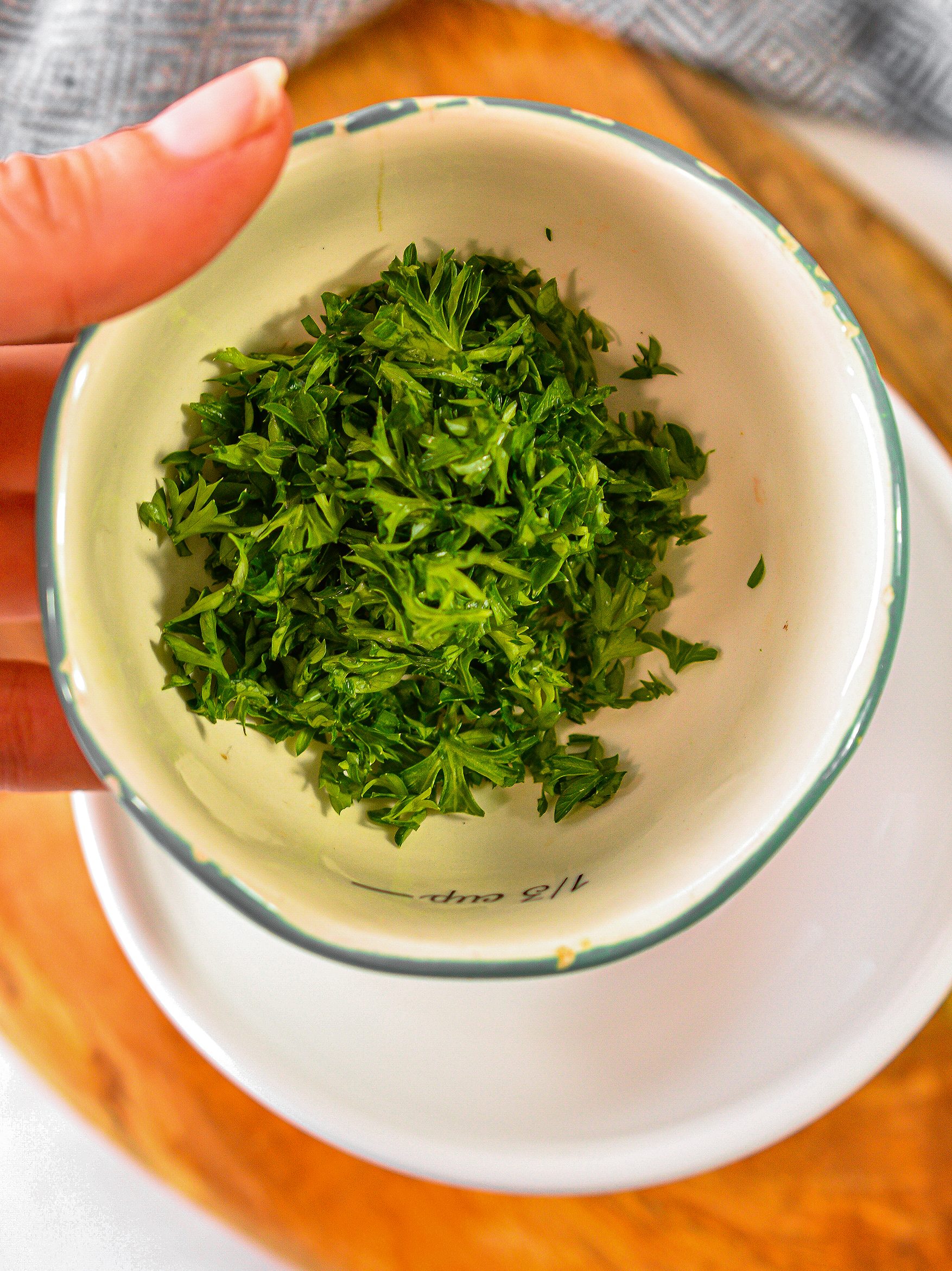 In a bowl, combine the parsley, mustard, garlic, salt, pepper, lemon juice and olive oil until well combined.
