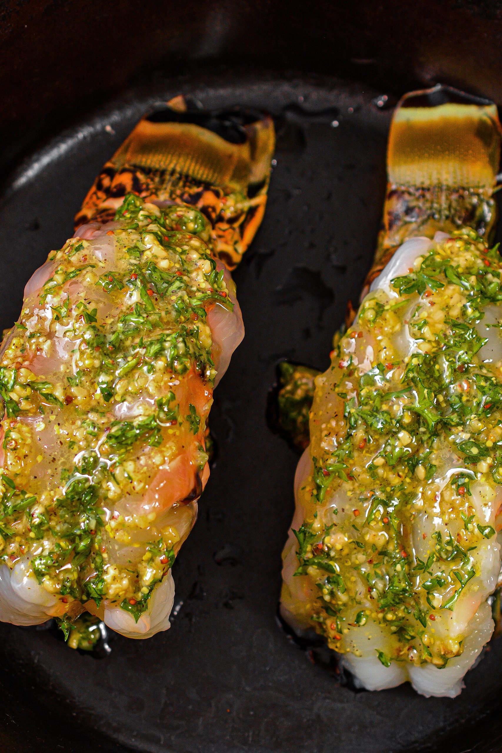 Spread the marinade over the top of each lobster tail.