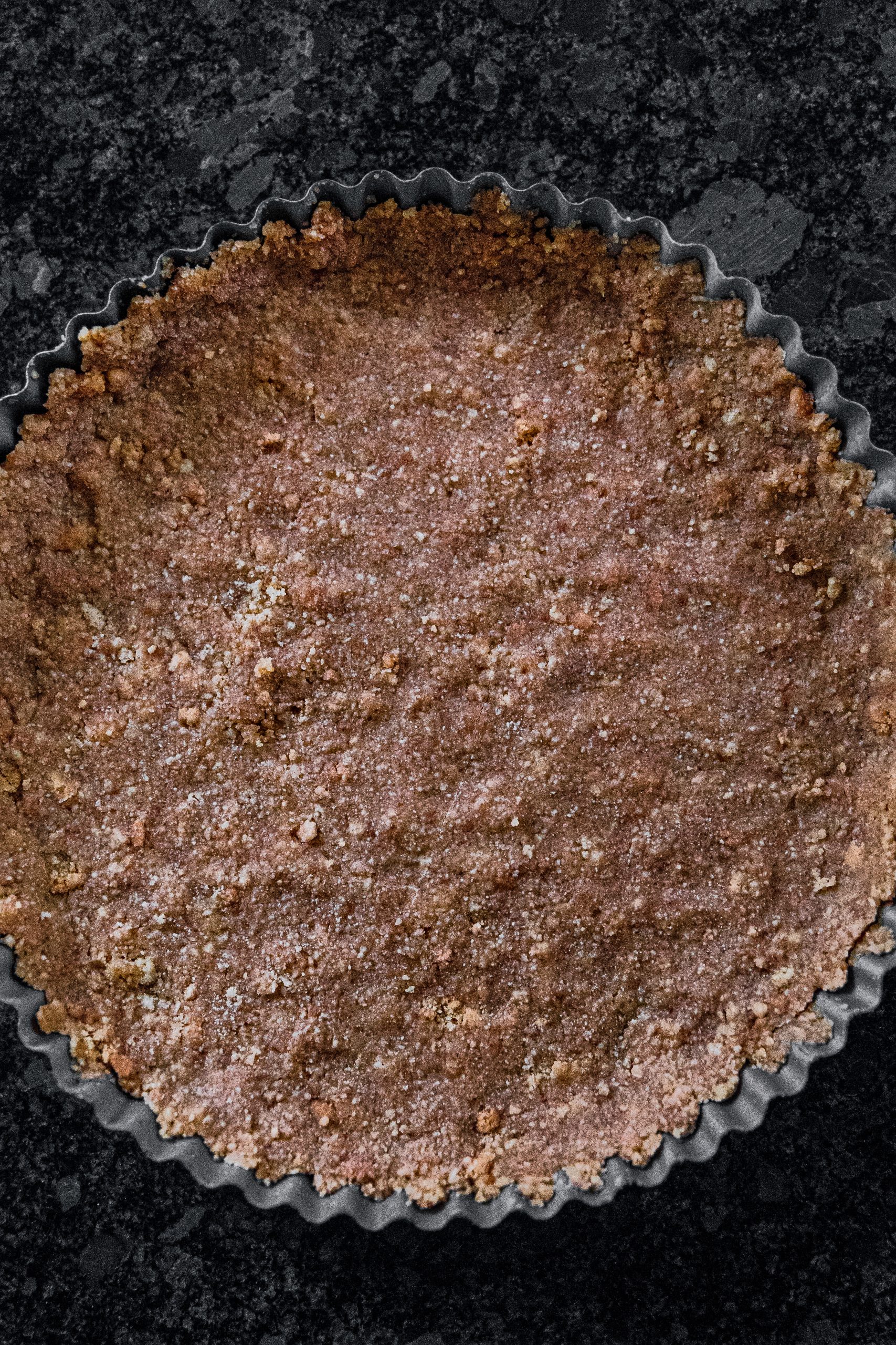 Line a pie tin with the graham cracker crust.