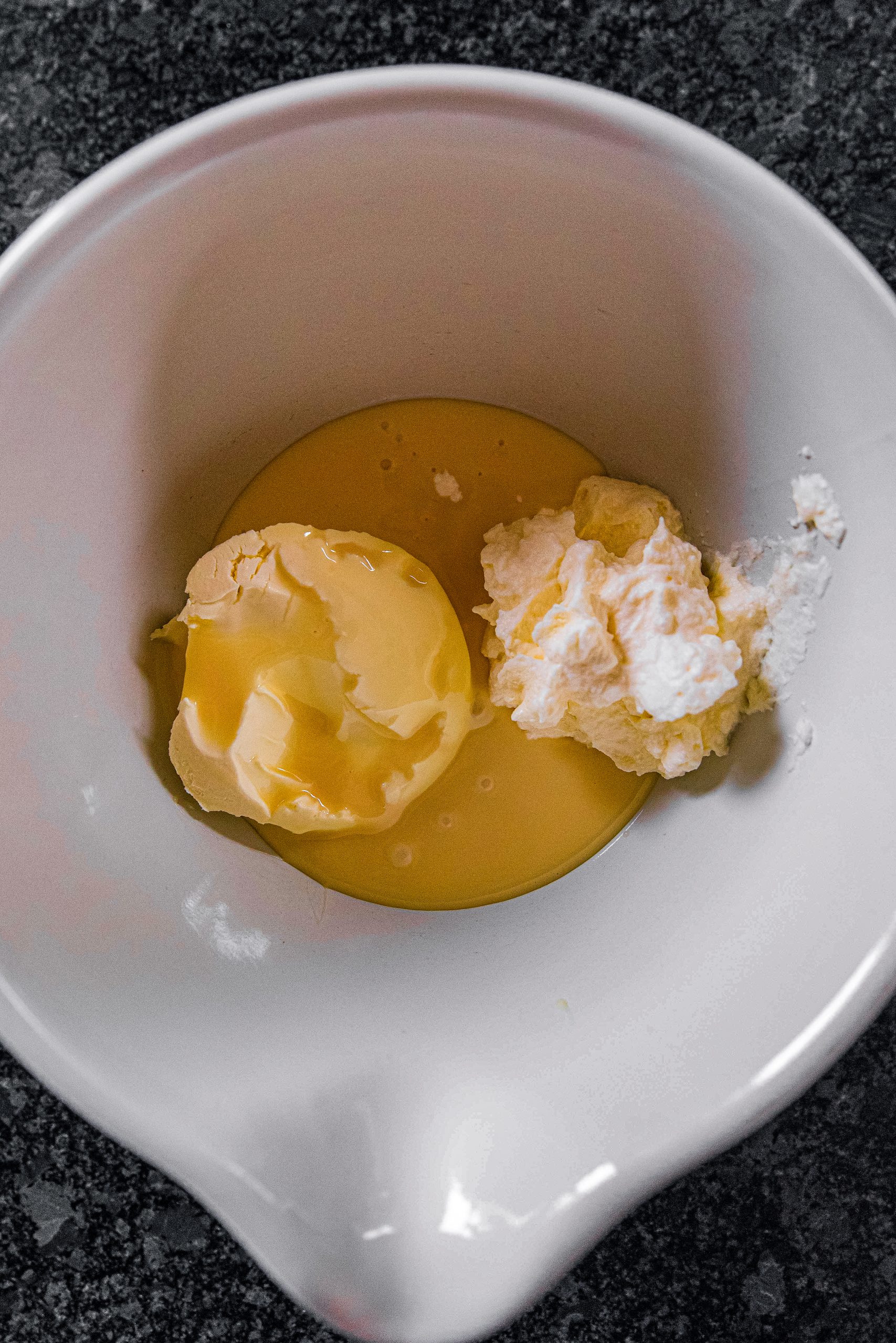 Whisk the cream cheese and condensed milk together.