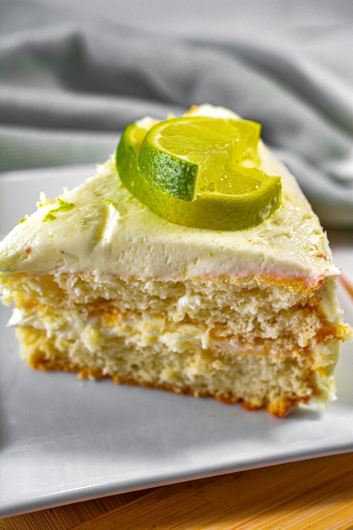 A layered cake with lime and cream cheese 