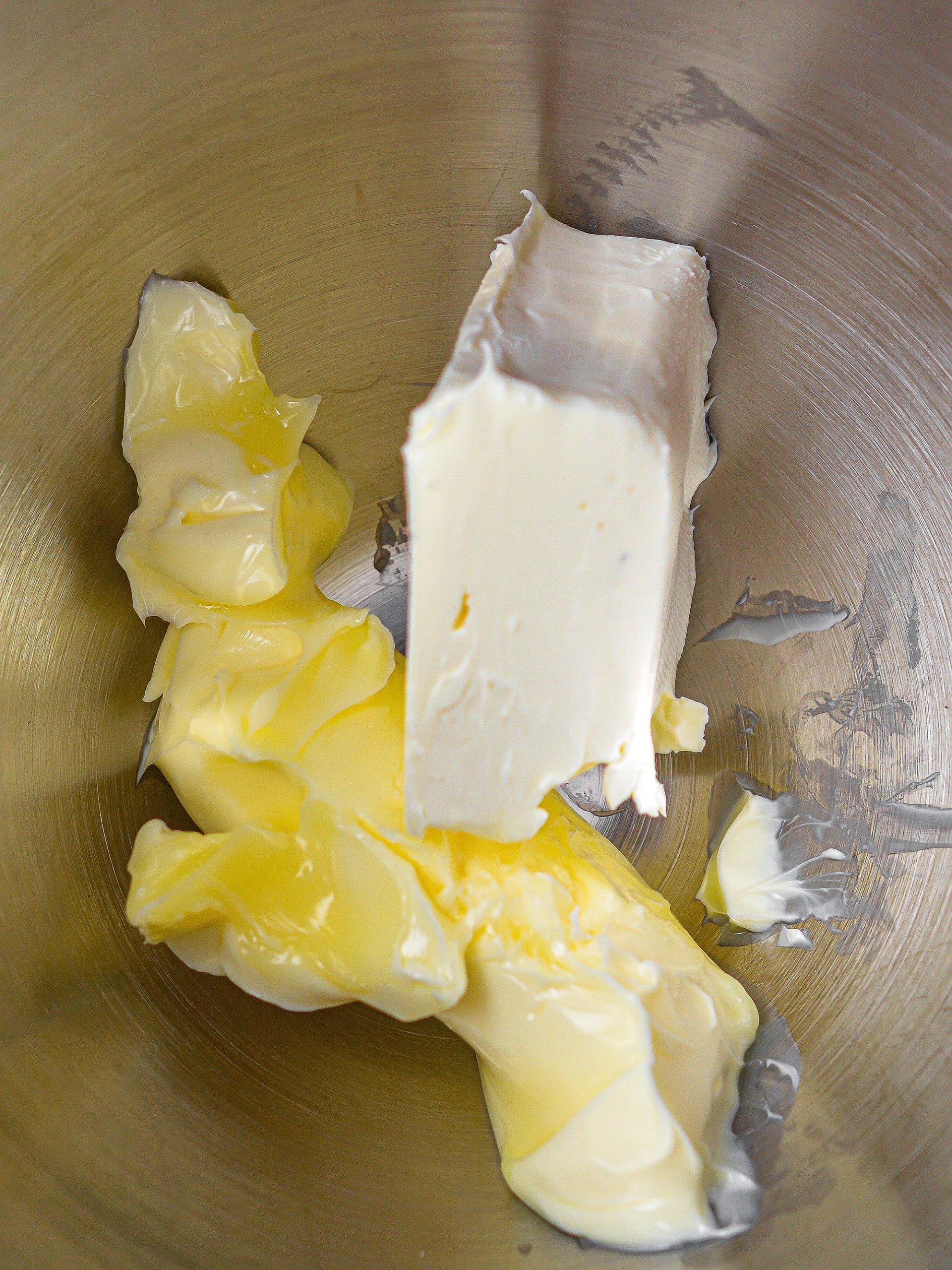 Place 4 oz cream cheese and 1 stick of butter in a mixing bowl and beat until creamy.