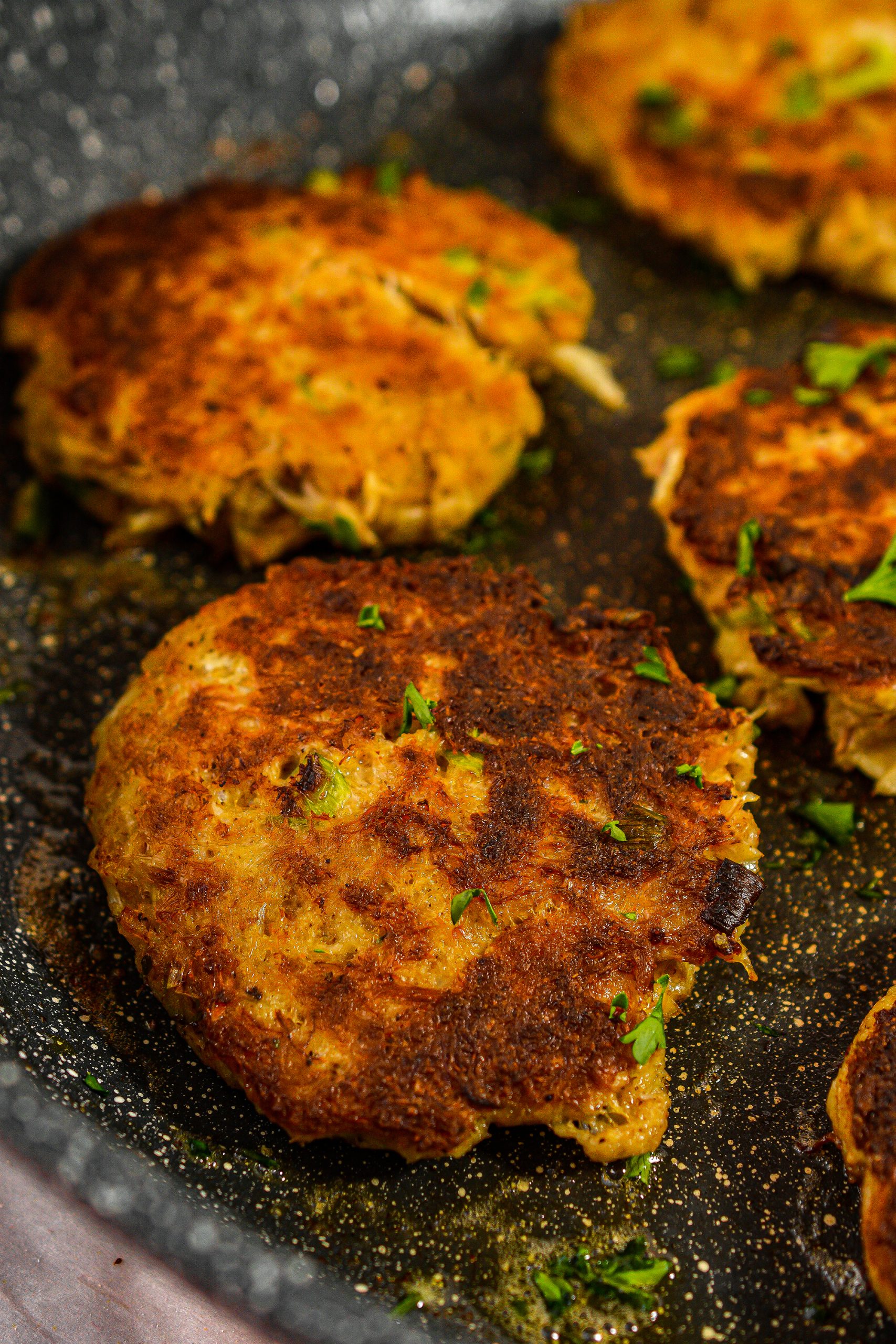 Form the crab mixture into 8 patties and fry evenly on both sides until browned and cooked through.