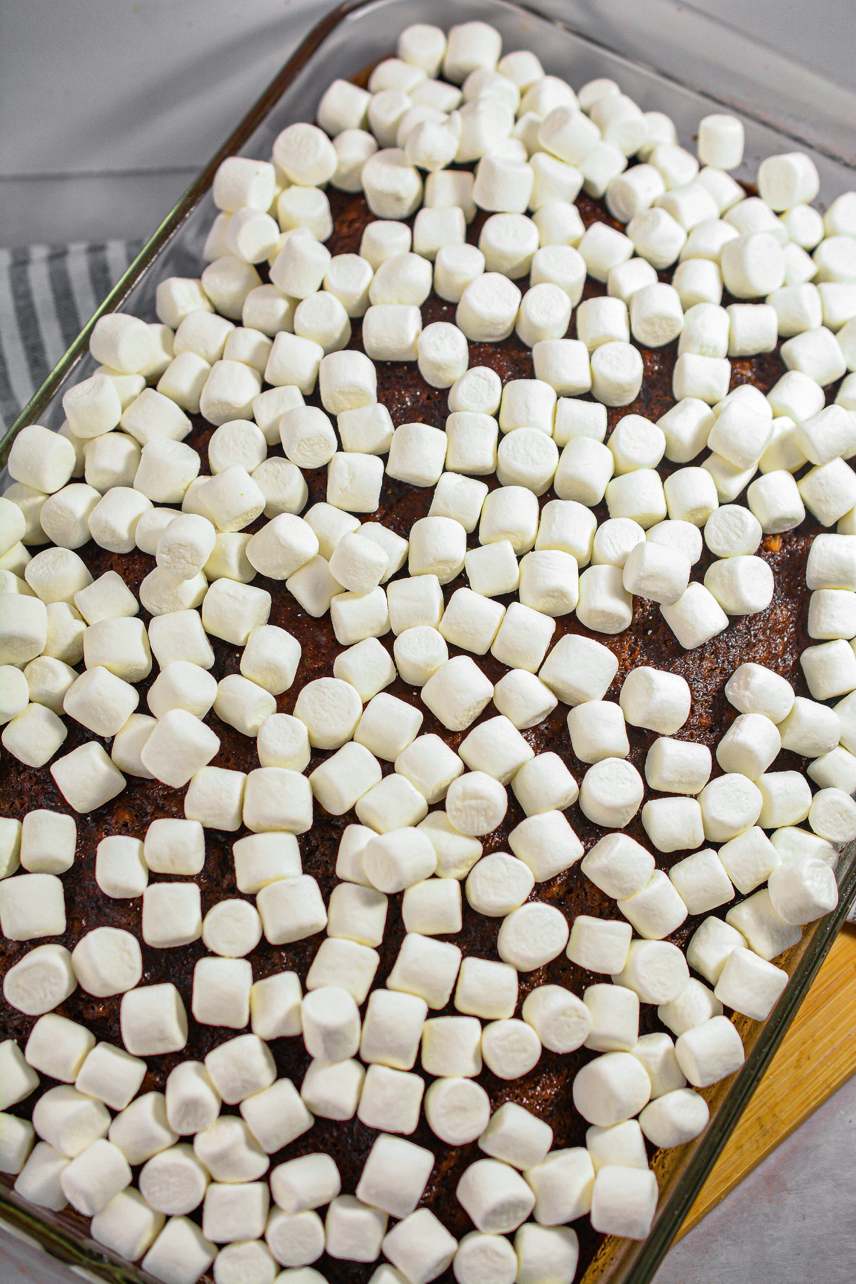 Spread the mini marshmallows over the cooled cake.