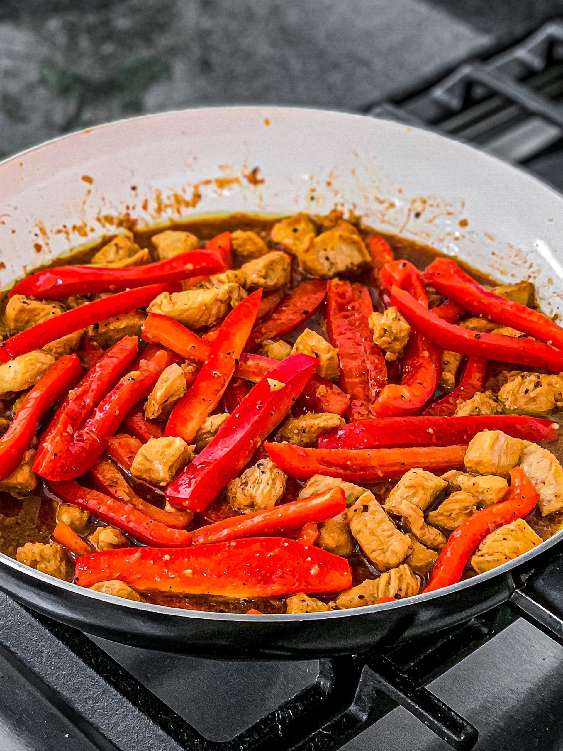Stir and cook for 10 minutes until peppers have softened.