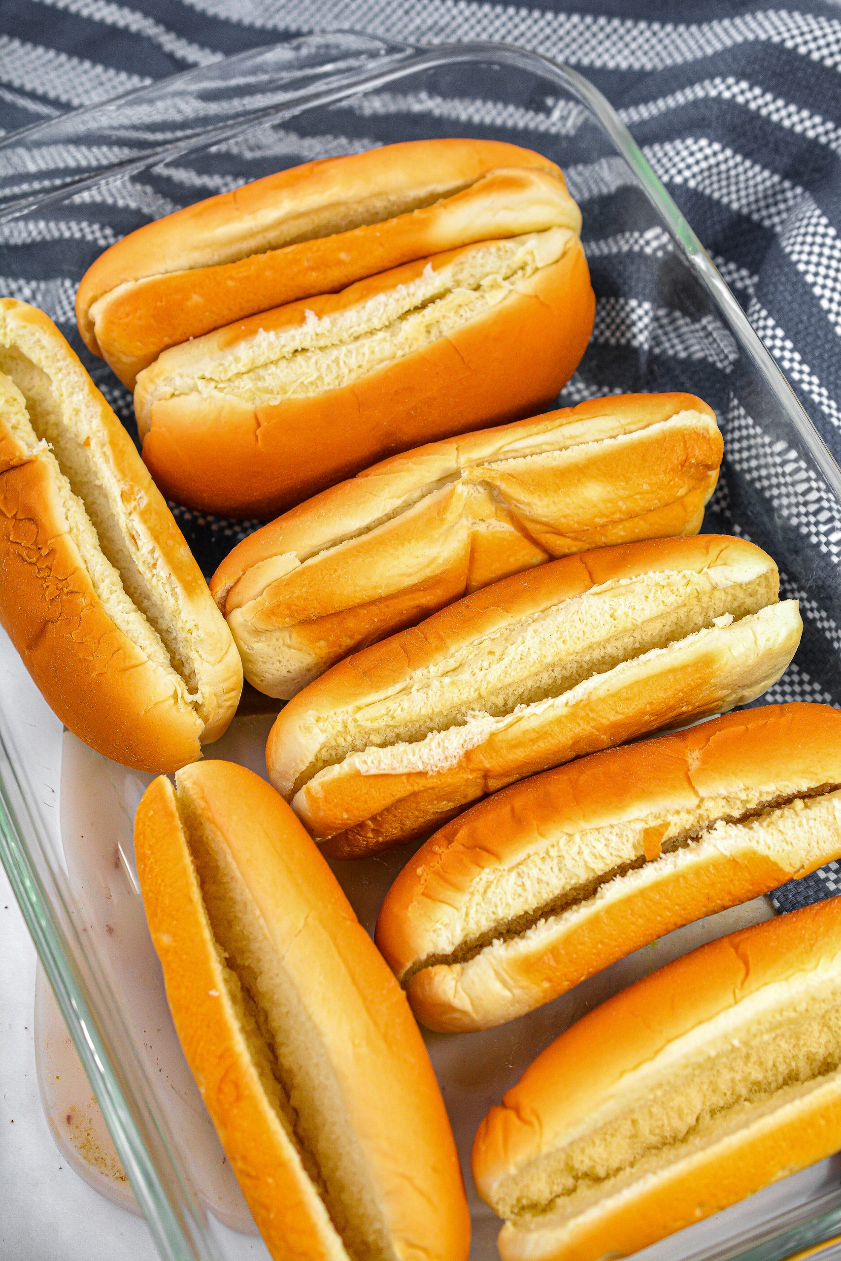 Place the hot dog buns in a single layer in a 9x13 baking dish.