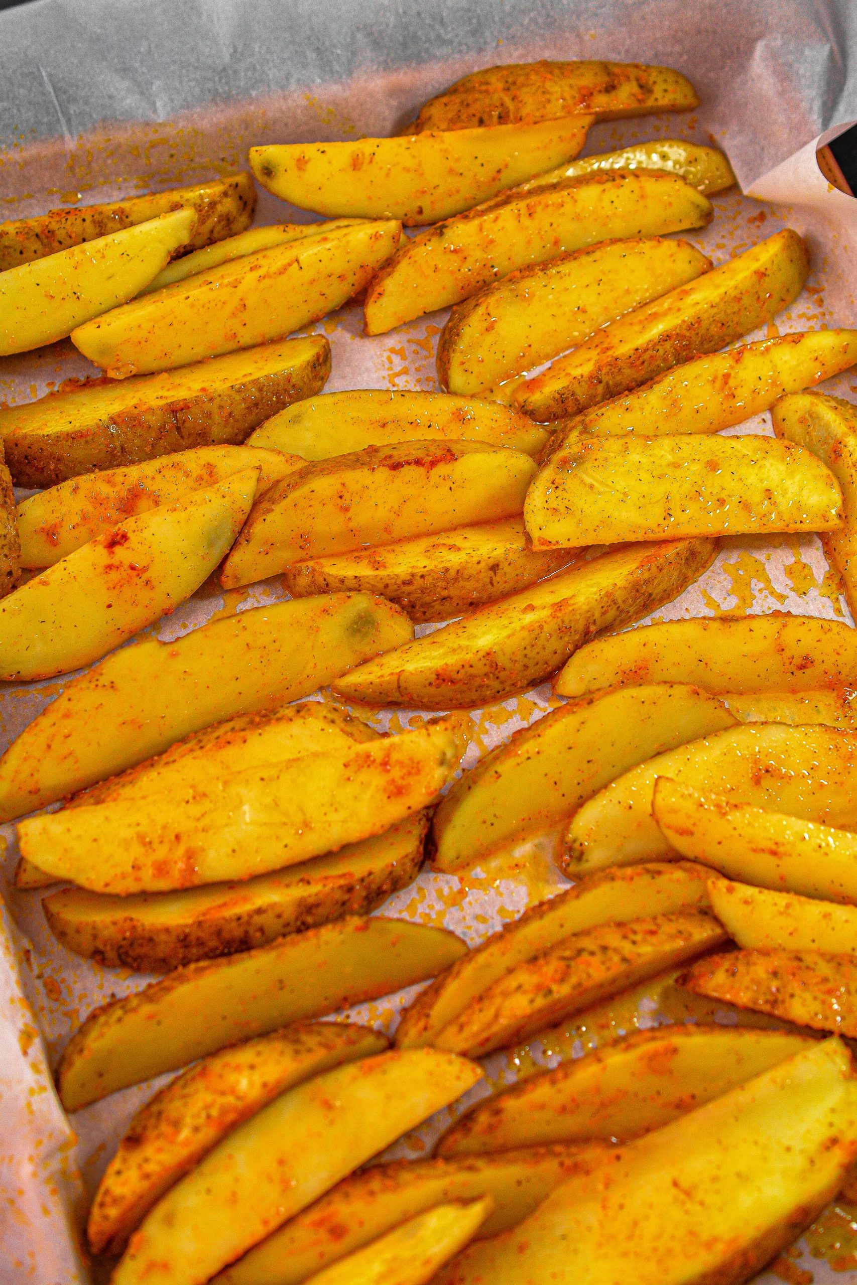 Spread the potato wedges on a parchment-lined baking sheet and bake for 30 minutes.