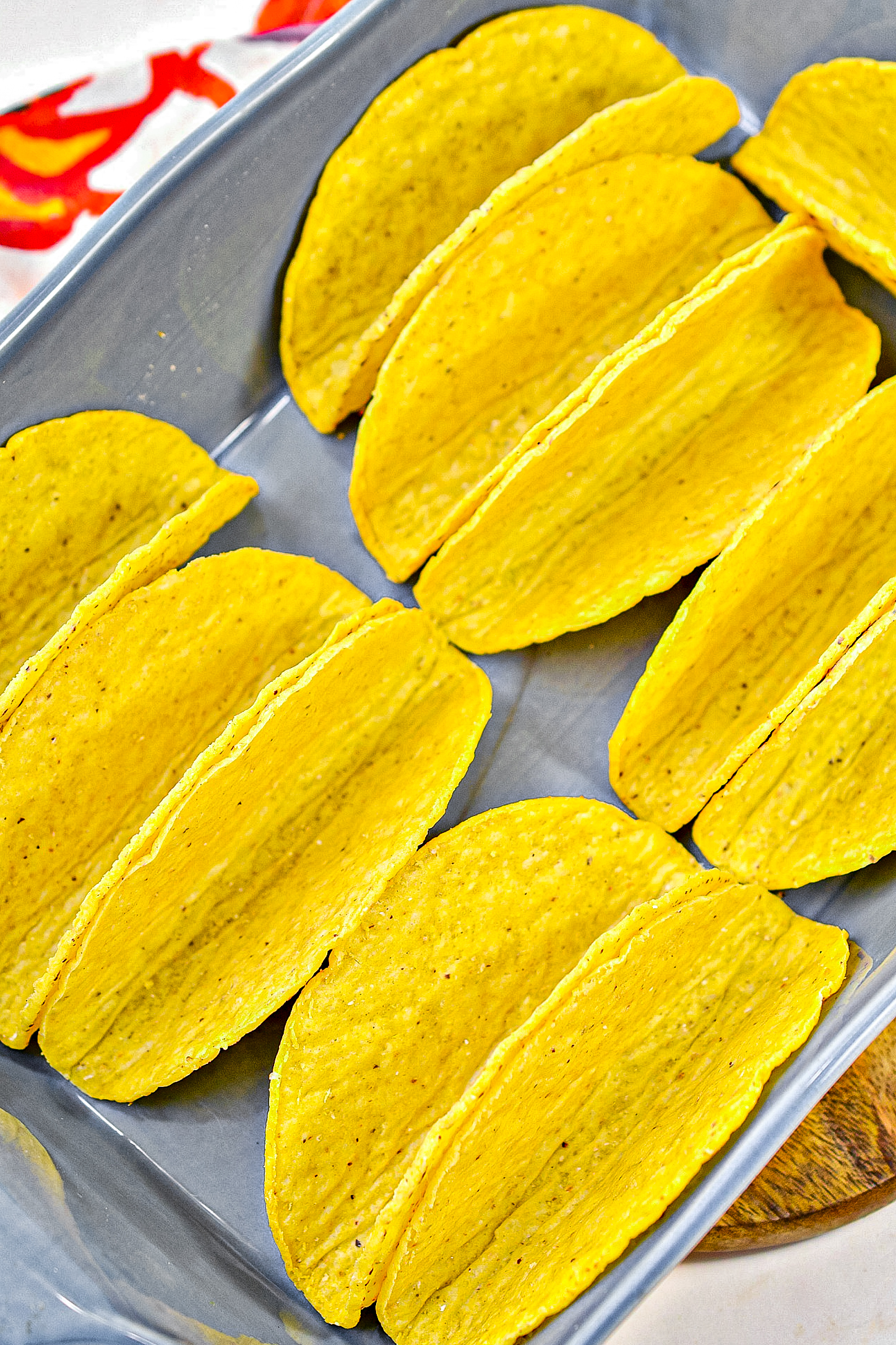 Line the taco shells standing upright in a 9x13 baking dish.