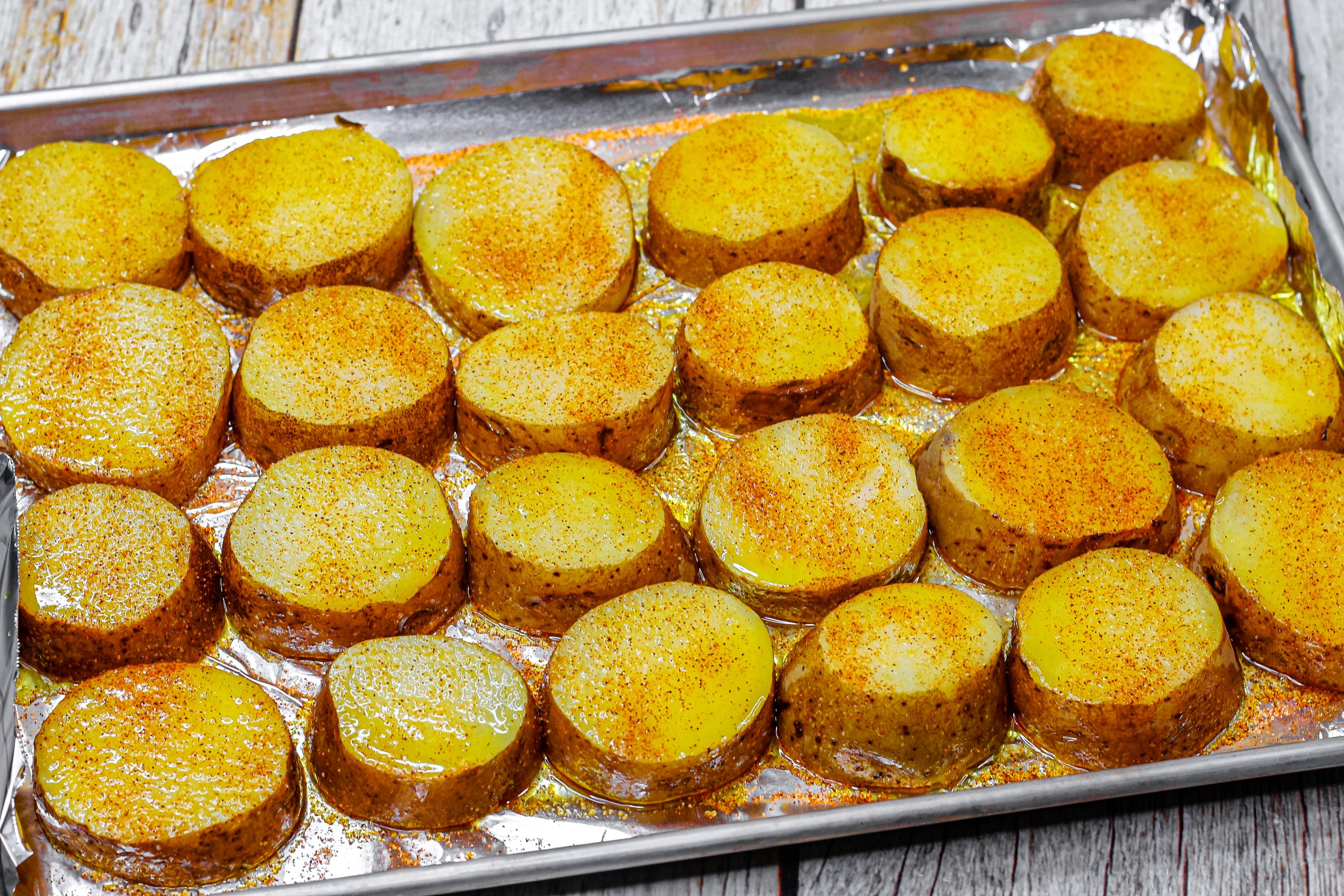  Place the potatoes onto the foil-lined baking sheet.