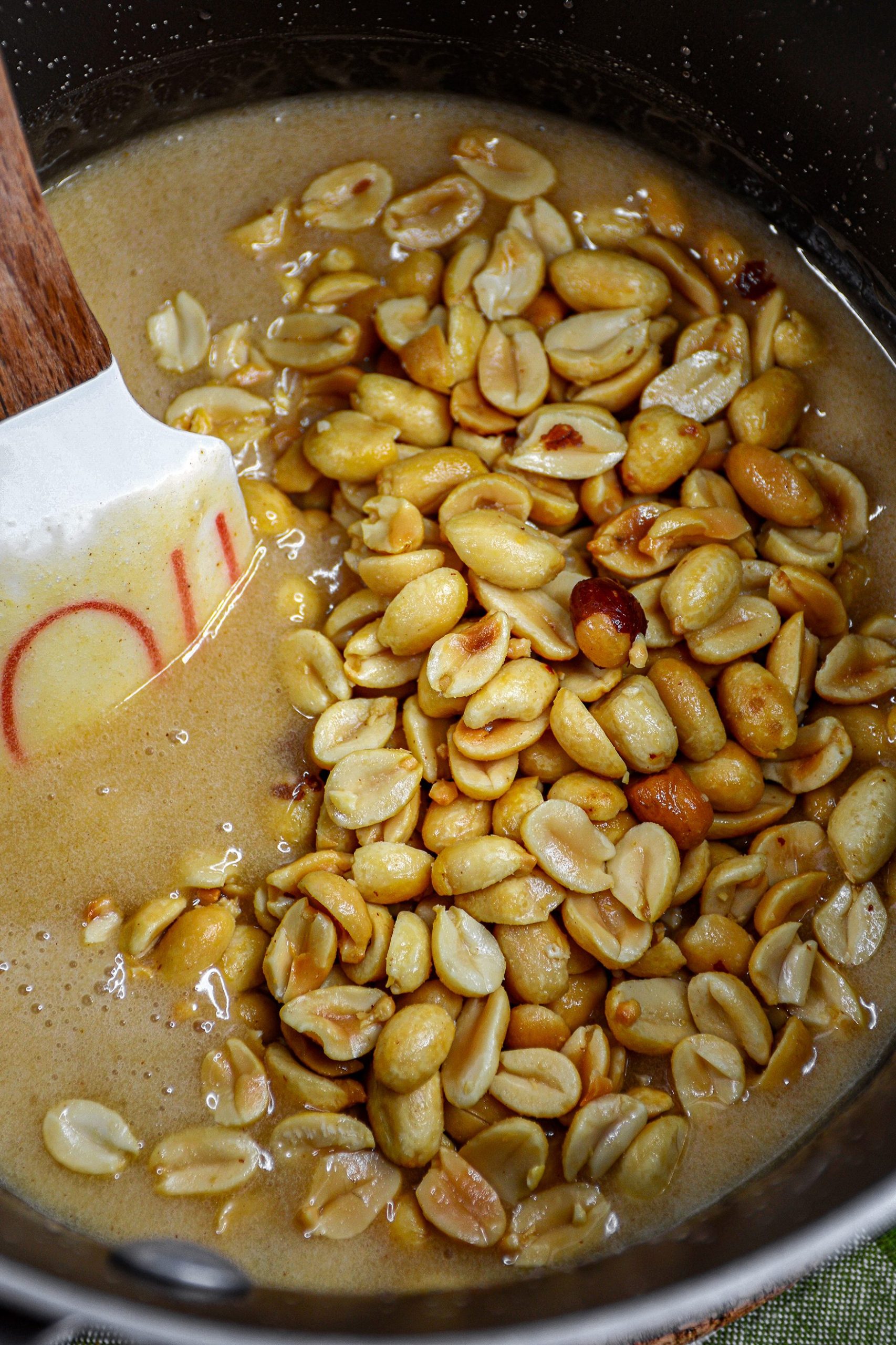 Heat the pot to medium, stir. Continue to stir until the sugar dissolves and the mixture comes to a boil.