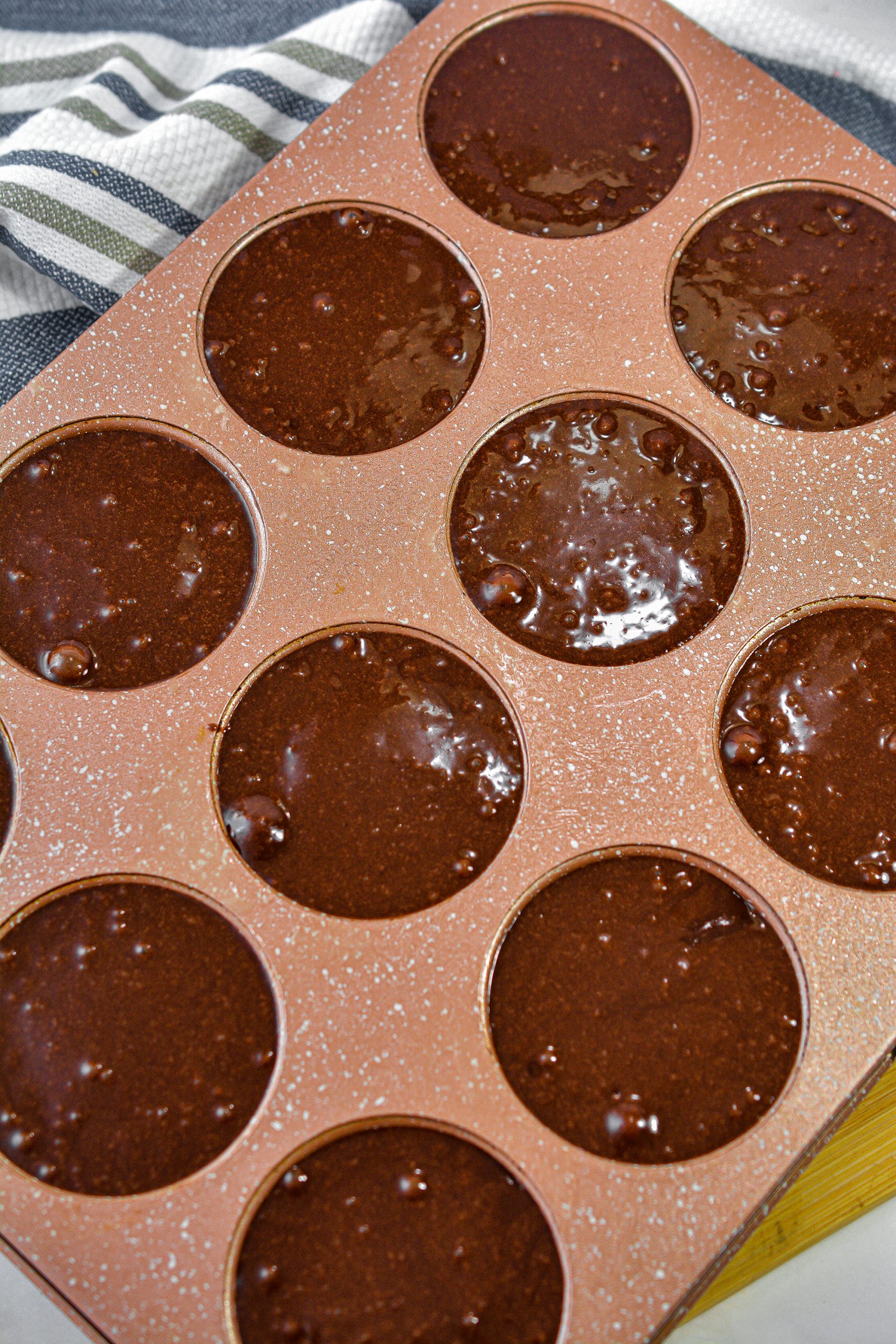 Fill the cups of the muffin tin the rest of the way with the brownie batter.