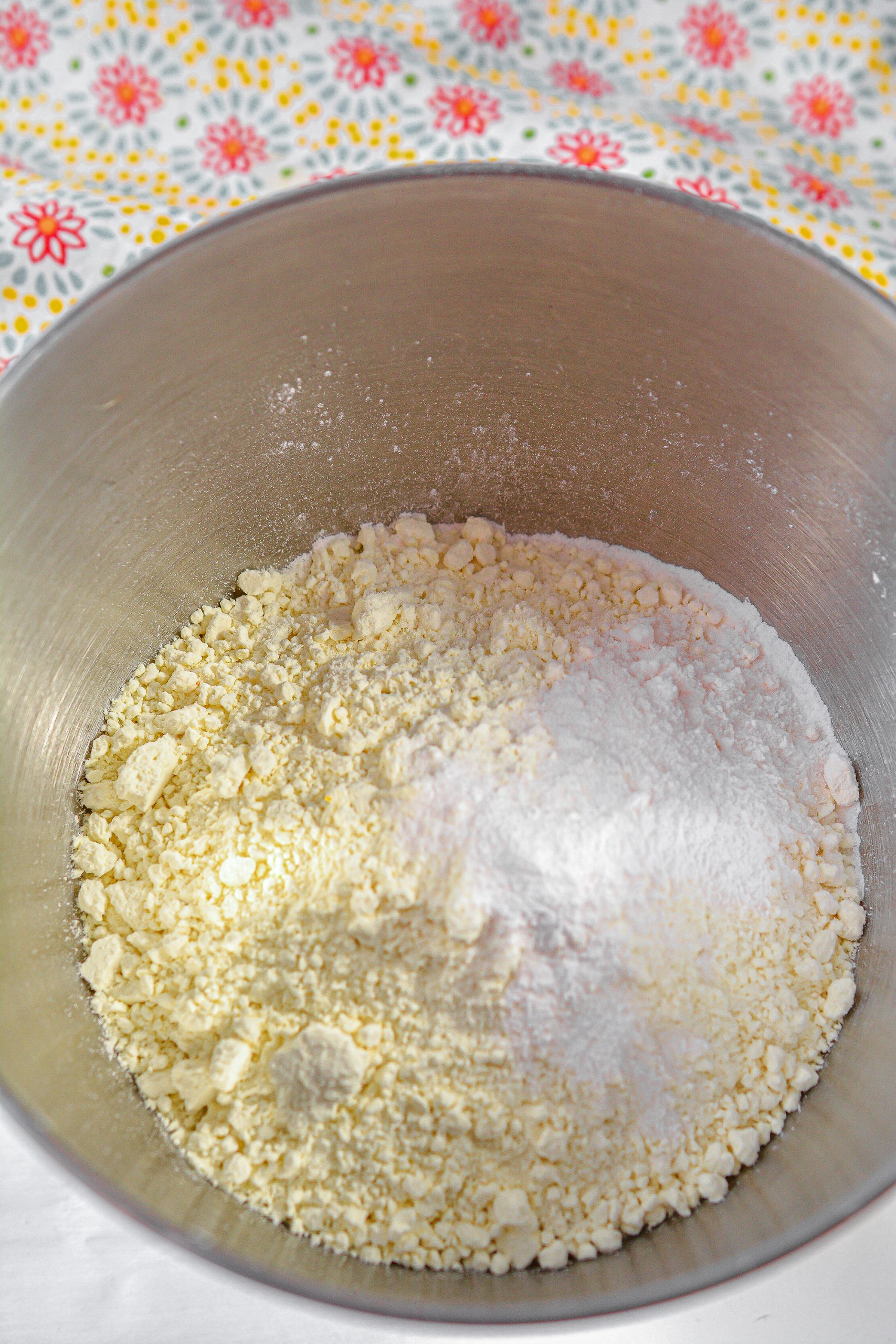 Place the cake mix, pudding mix, and undrained can of crushed pineapple into a mixing bowl beat on high until well combined.