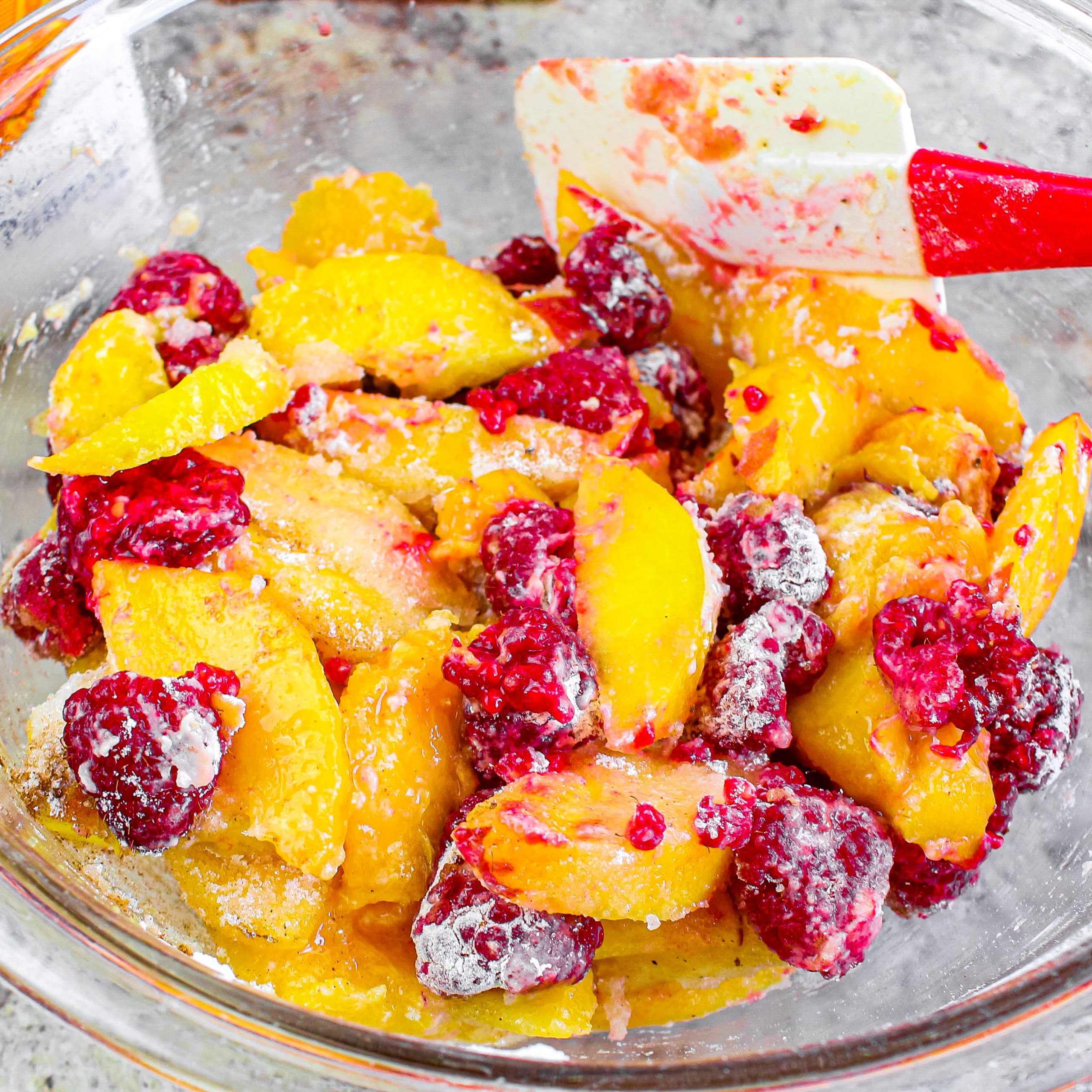 Thinly slice each peach (about 1/2 inch thick) and place the peach slices in a large mixing bowl. Add the raspberries, lemon juice, 3 Tablespoons of flour, granulated sugar and 1/2 teaspoon cinnamon. Gently stir about 3-4 times or until the flour is absorbed.
