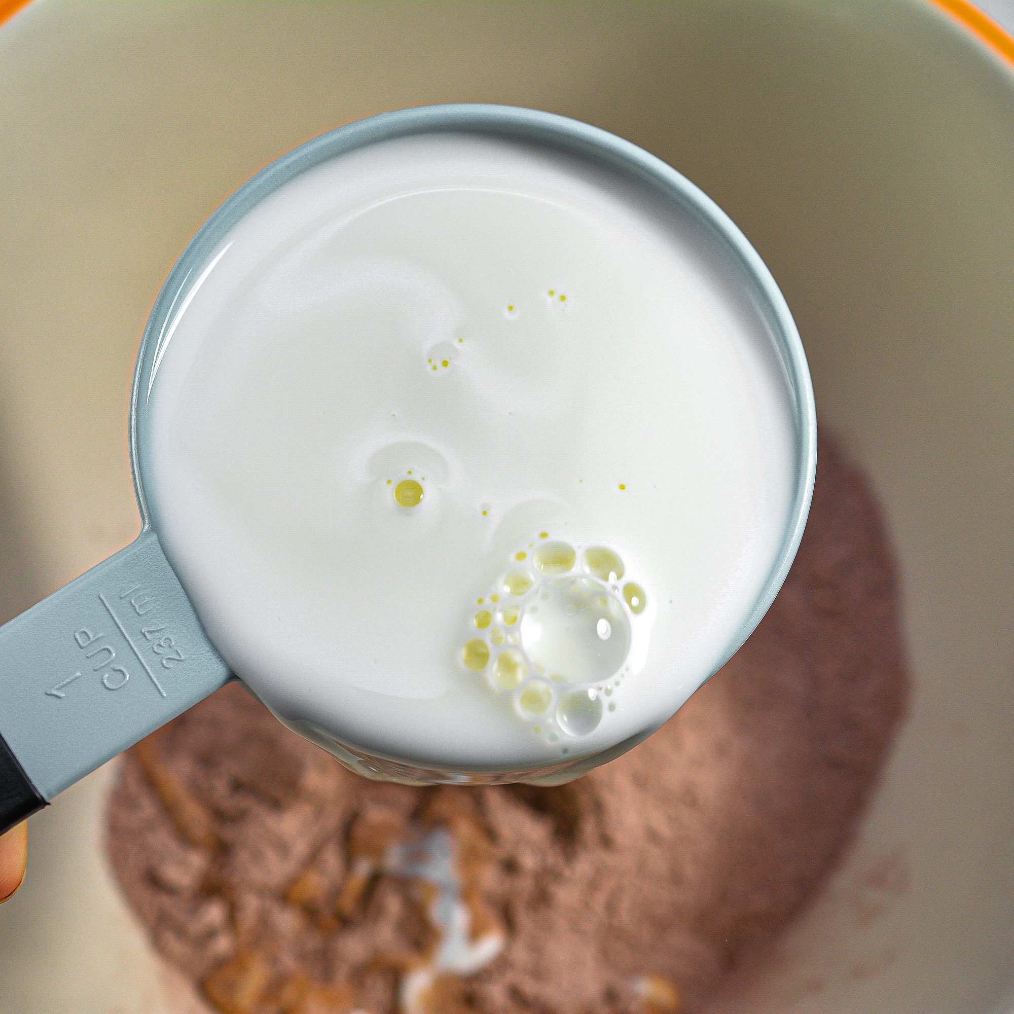 Place the instant chocolate pudding and the milk into a large mixing bowl, and whisk to combine until smooth. Let set for 5 minutes.