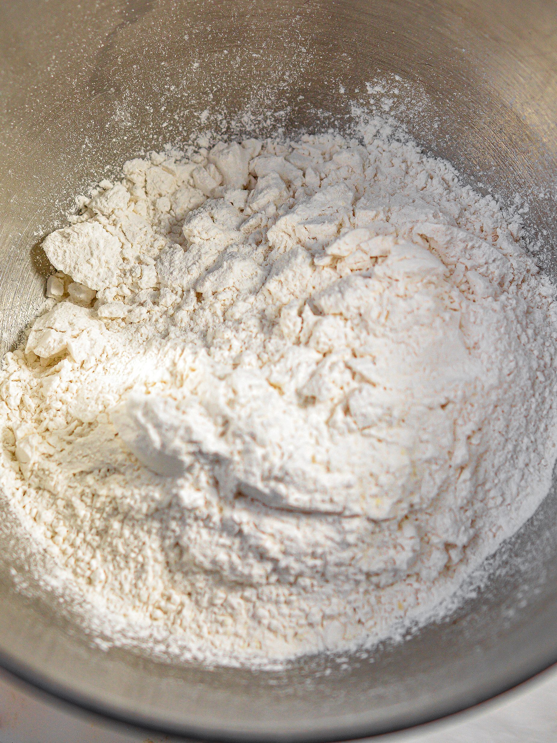 In a mixing bowl, combine 2 ¼ cups of the flour, yeast, ¼ cup sugar and 1 tsp. ½ tsp. Salt.