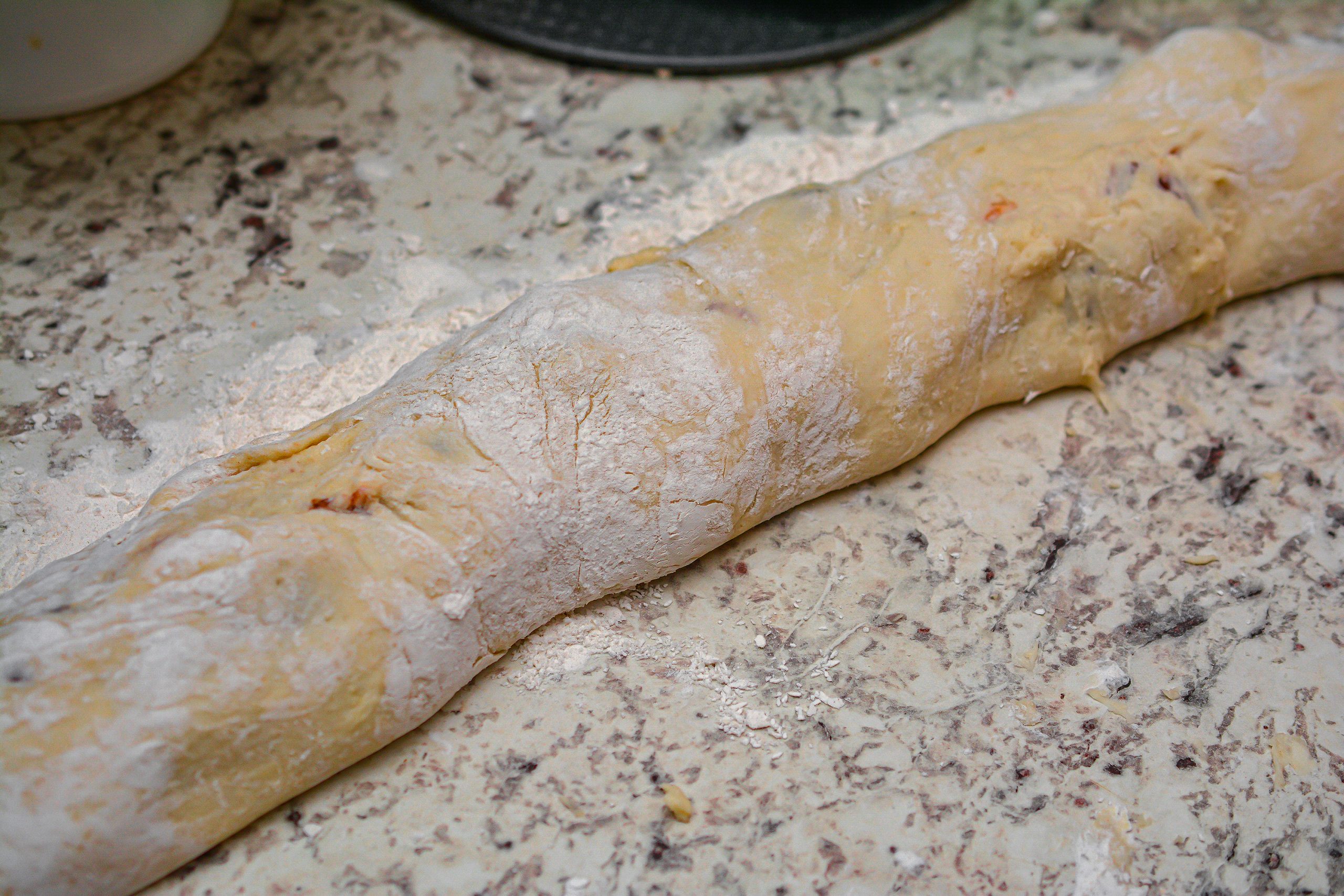 Carefully roll the dough up, and then slice into 12 even sections.