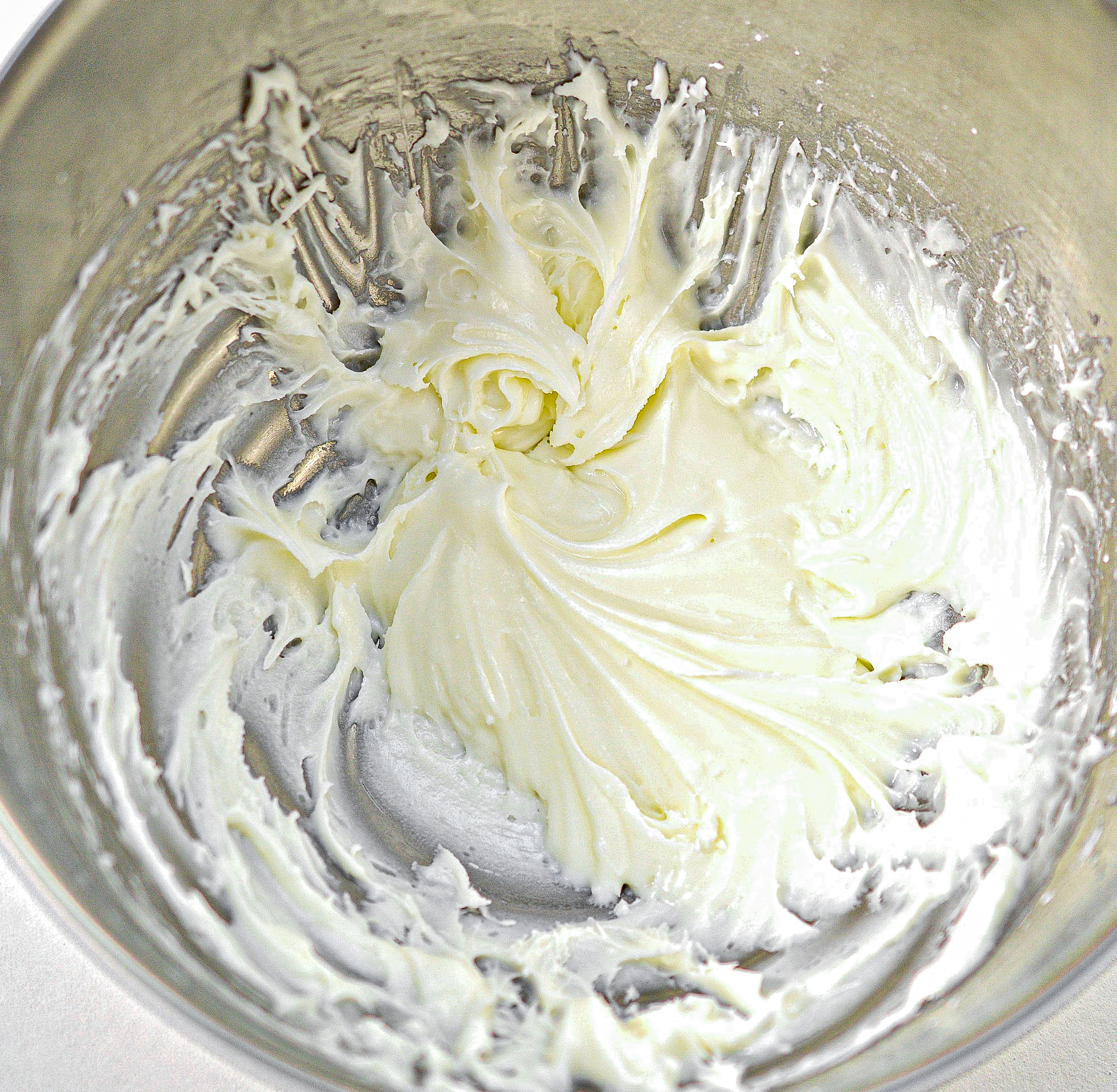 In another mixing bowl, combine the butter-sugar, and vanilla, and beat until fluffy.