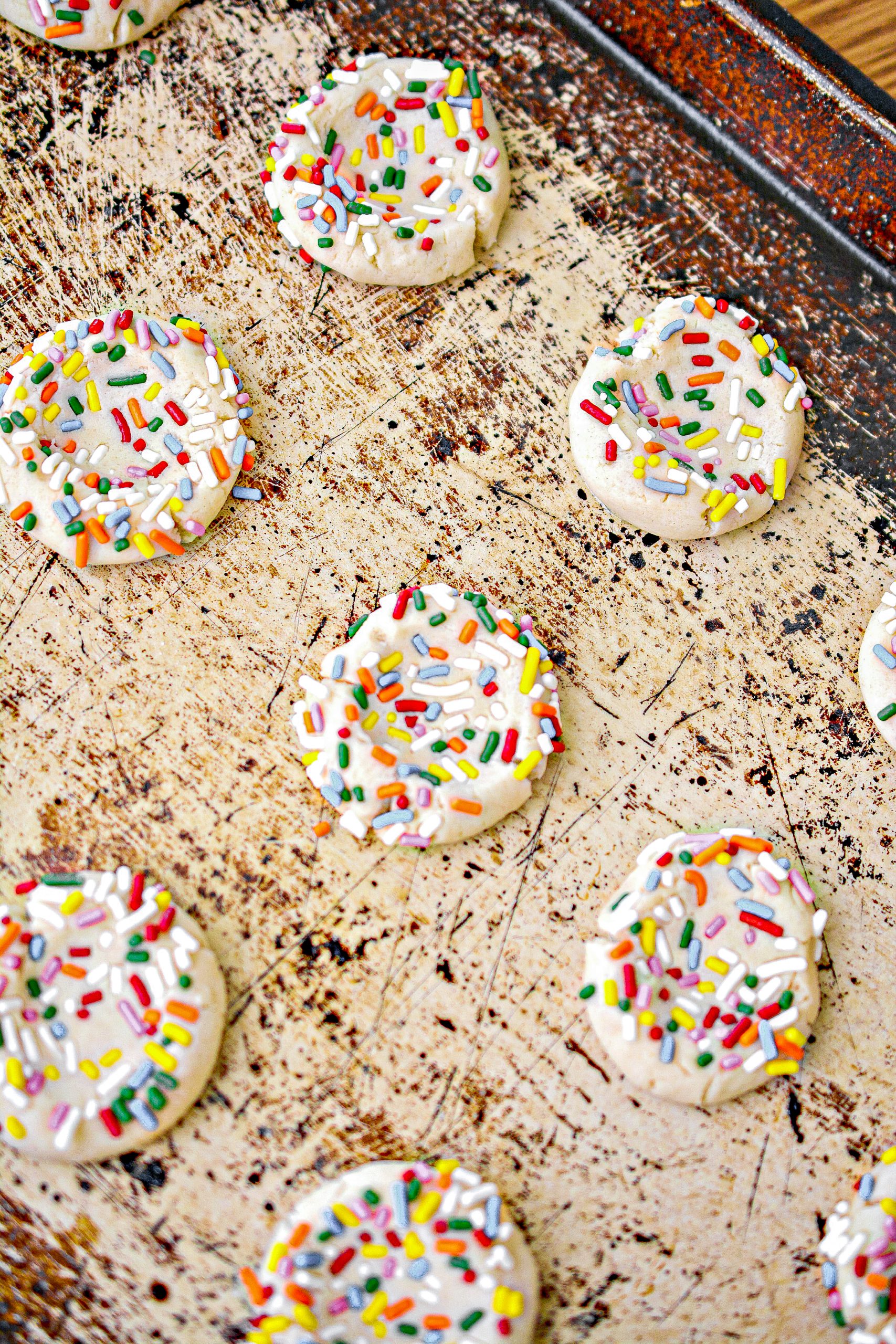 Press the balls of dough into the sprinkles.