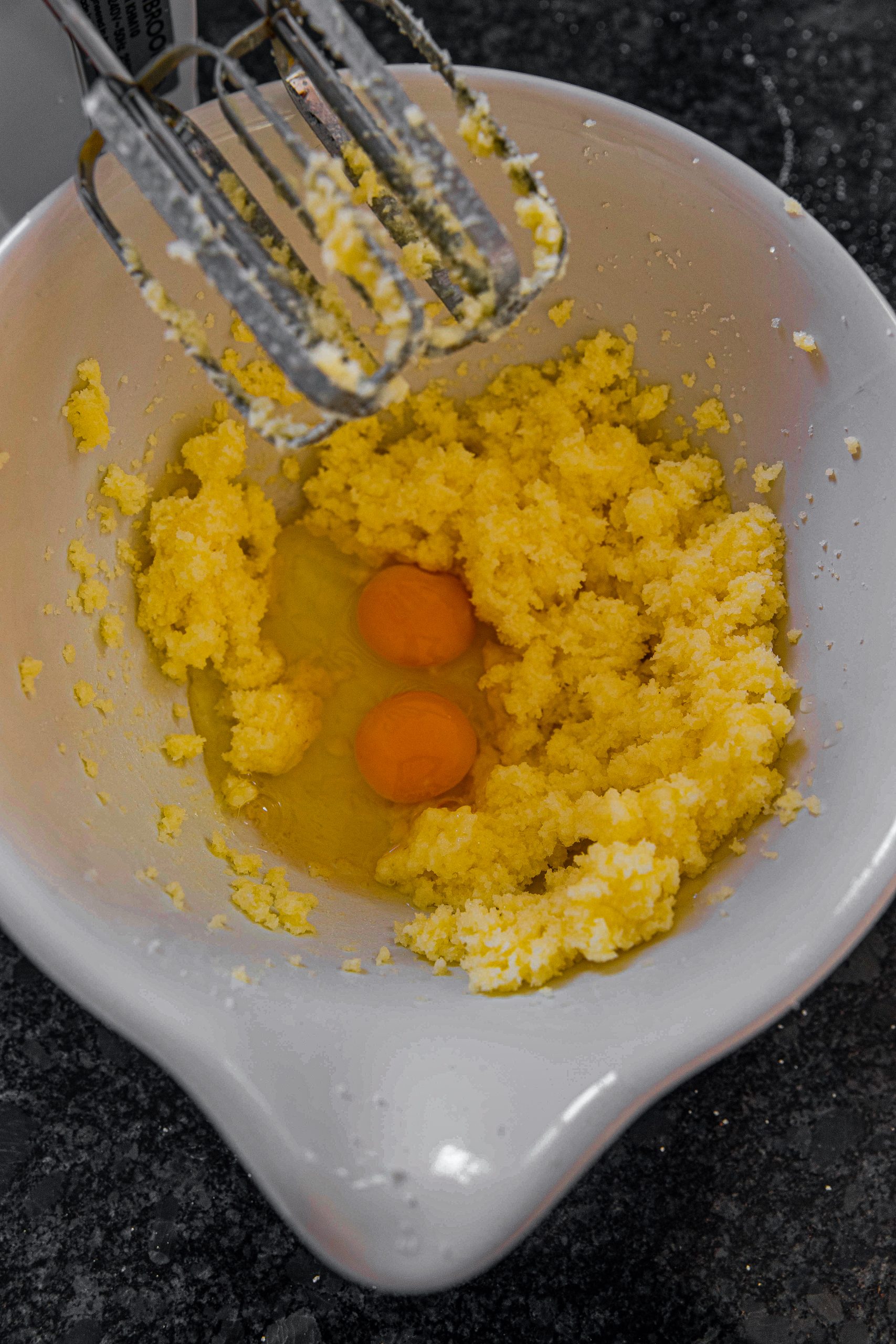 Add a ½ cup of butter and 1 cup of raw sugar in a medium mixing bowl. Using an electric mixer, mix it until it’s creamy. 