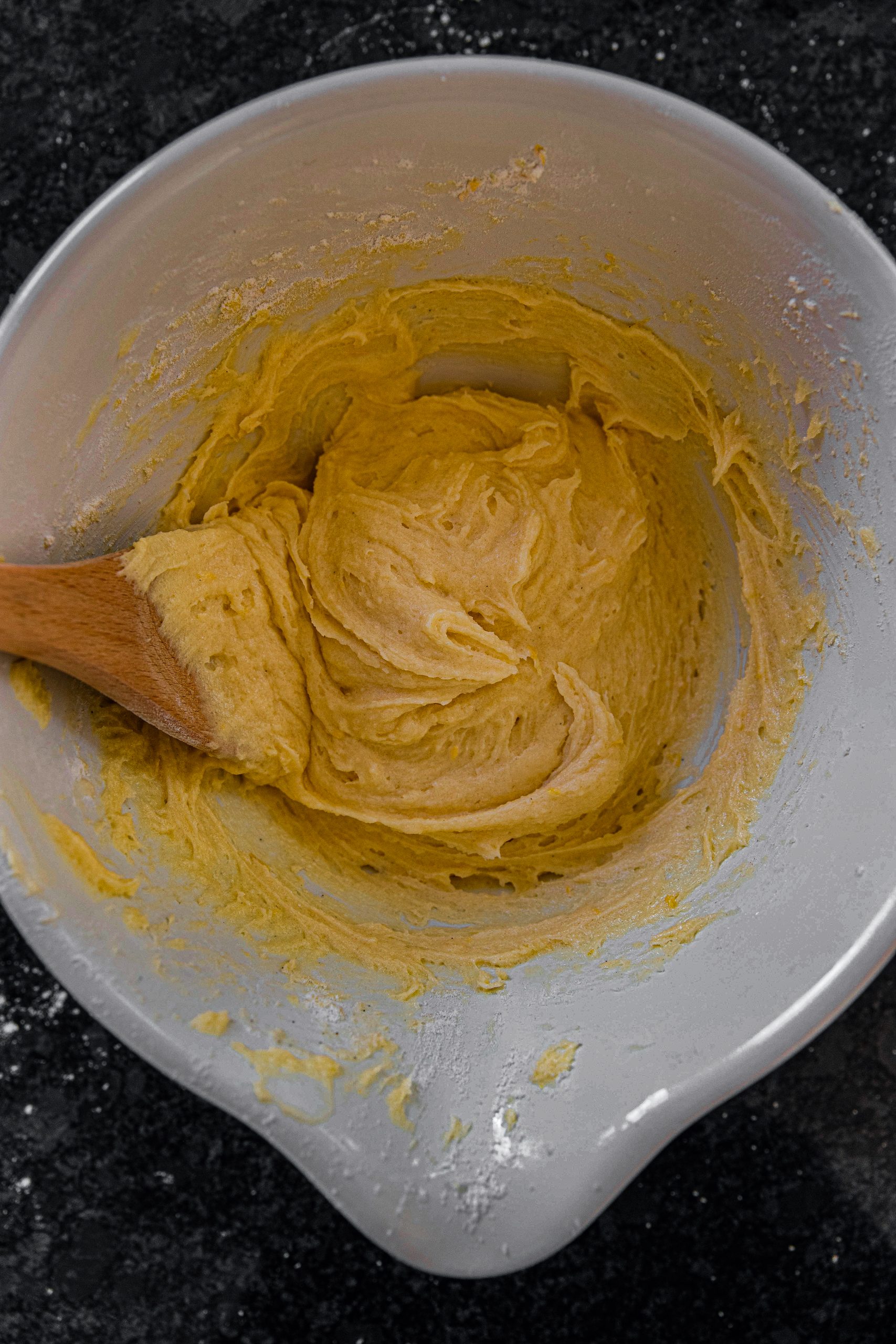 Add in the flour, lemon zest and water into the bowl and stir until it’s well mixed. Make sure it’s not lumpy!