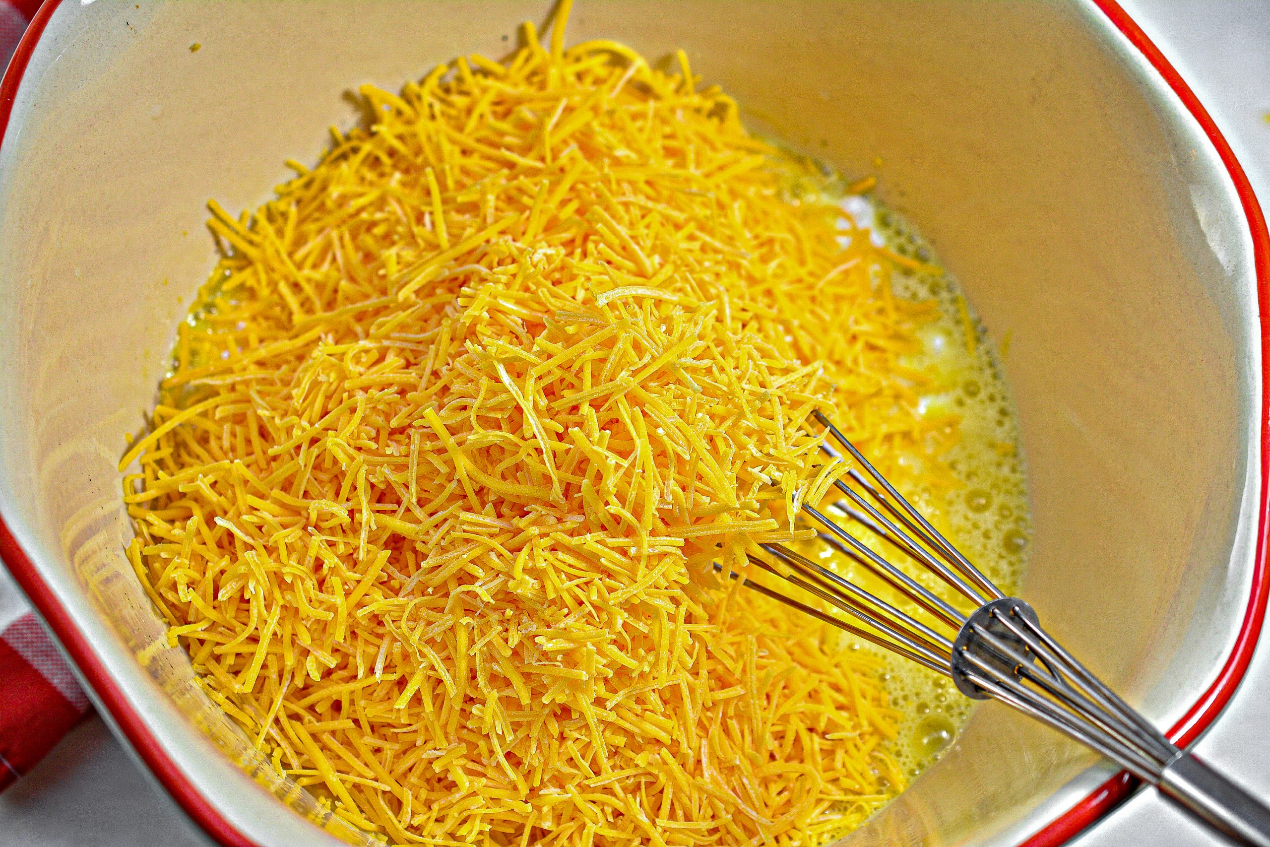 Mix together the eggs, cottage cheese, cheddar cheese, the meat mixture, and salt and pepper to taste until well blended.