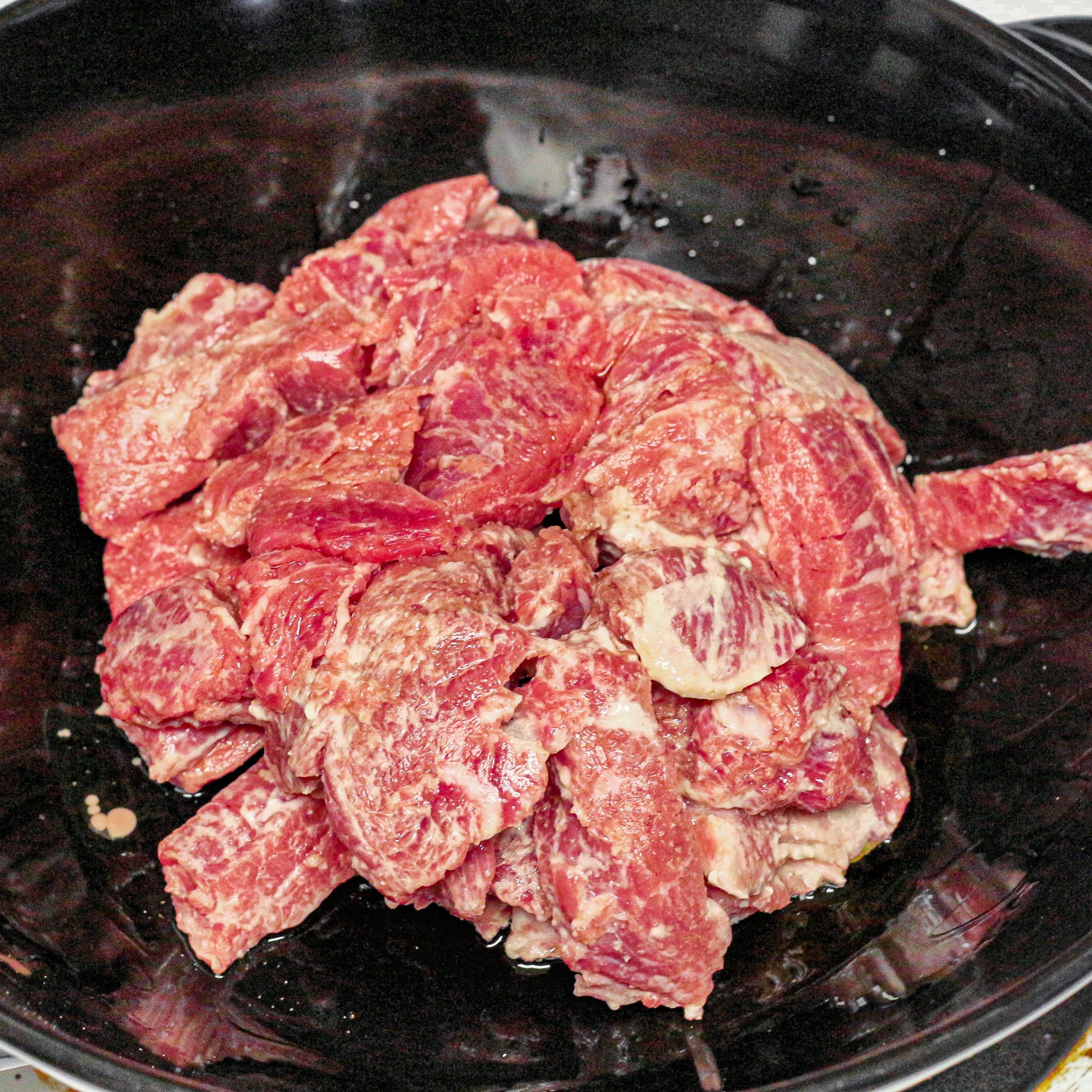 In a large wok over medium-high heat, stir-fry beef in 1 tablespoon oil until beef is browned.