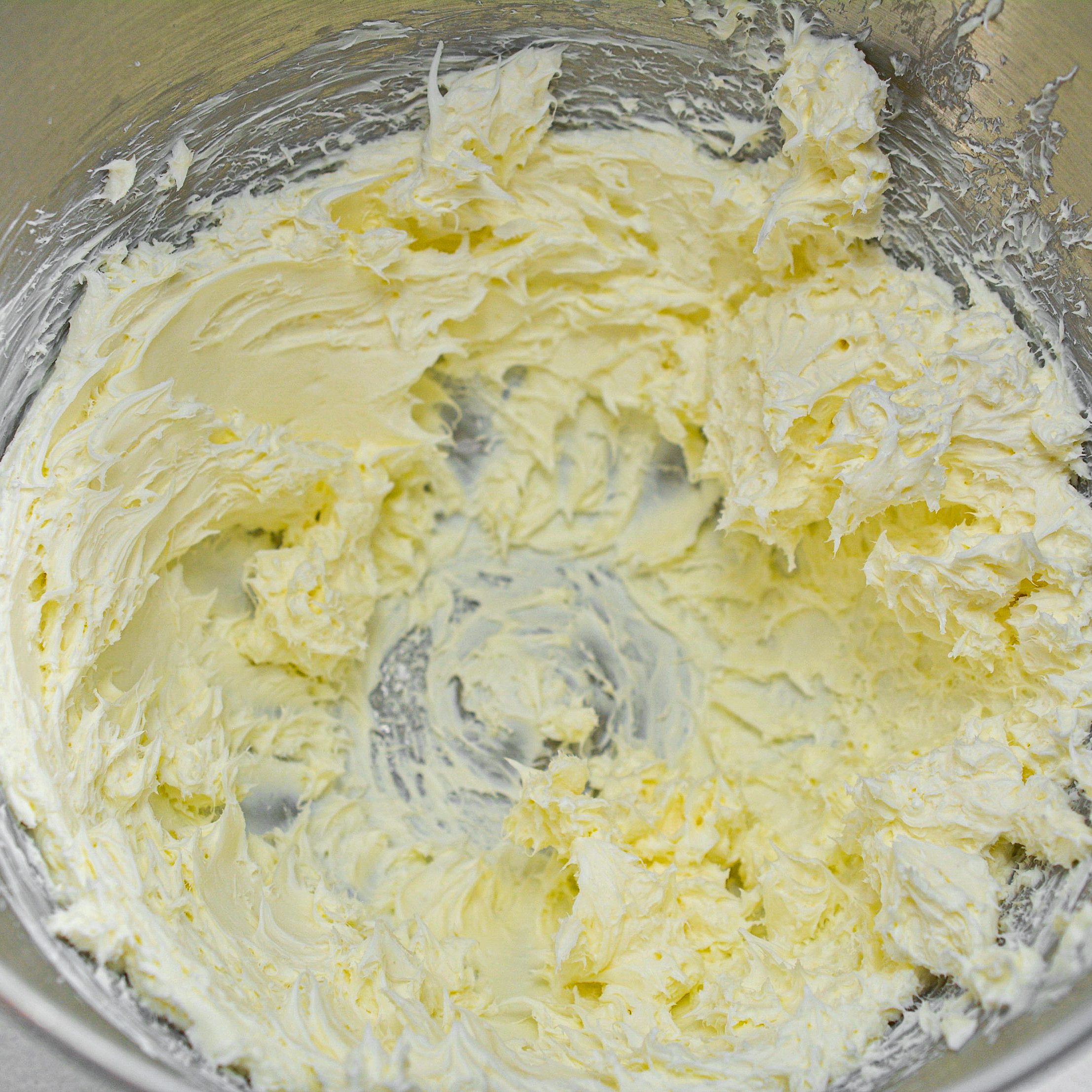Cream cheese in a mixing bowl until smooth.