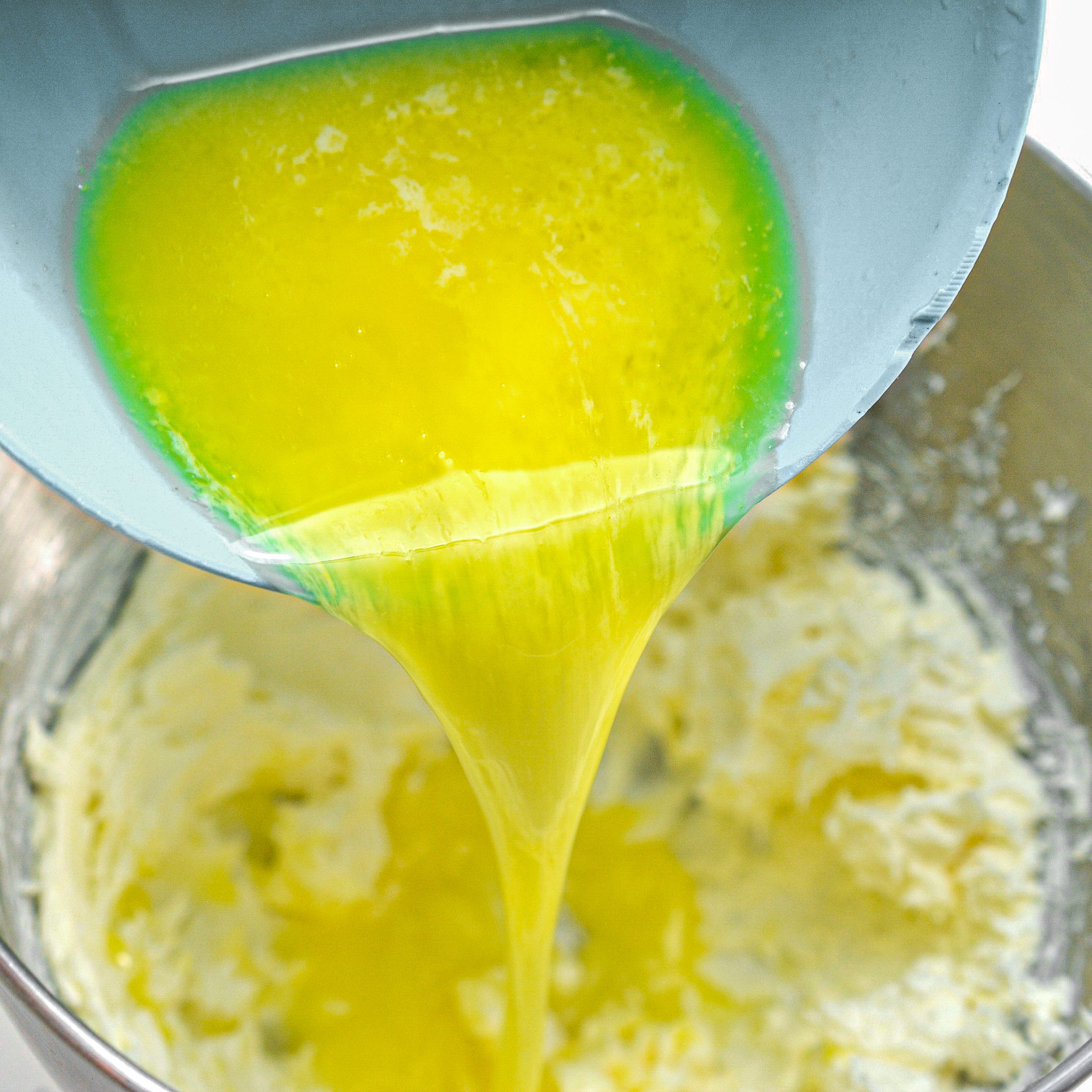 Add the melted butter to the cream cheese, and blend again until smooth and creamy.