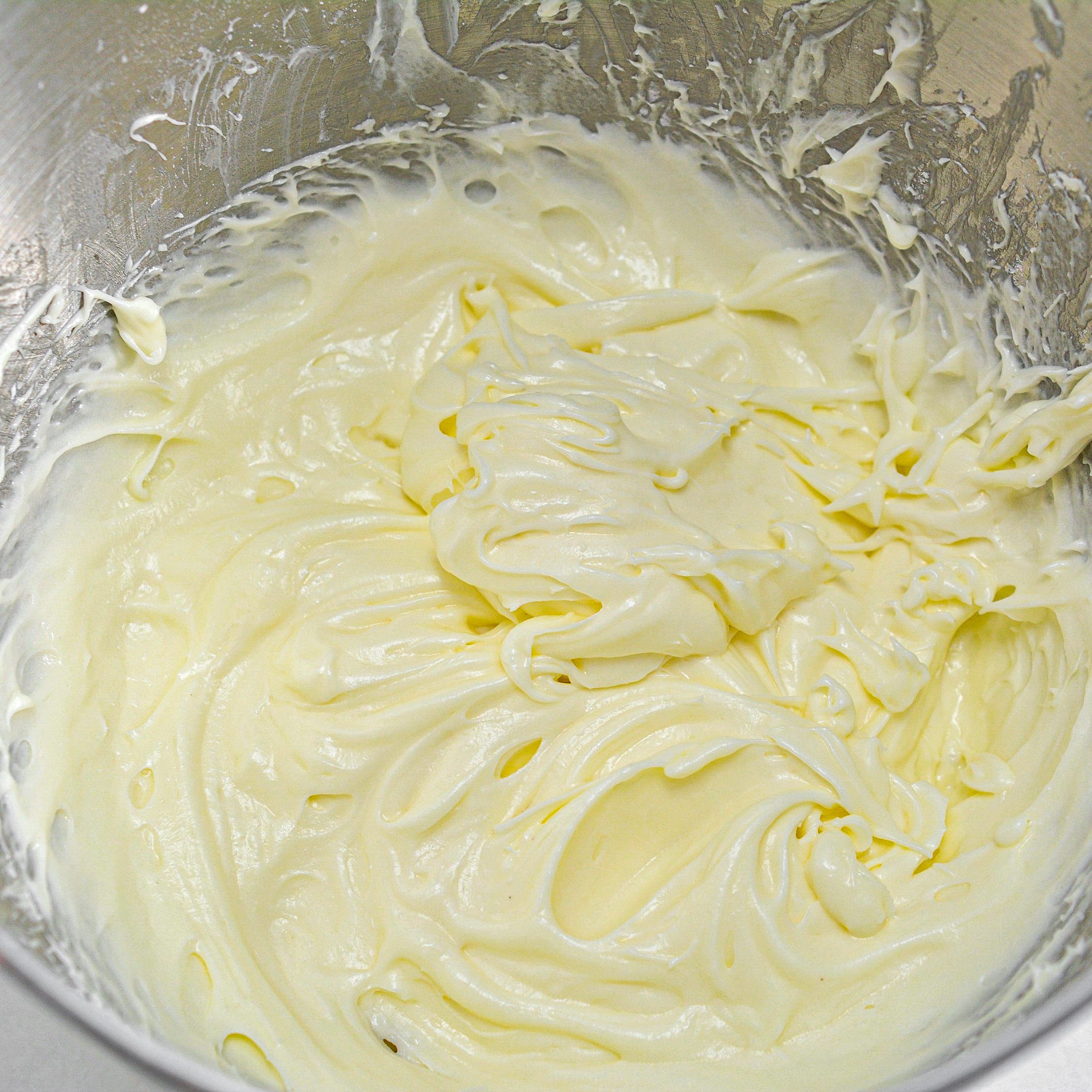 Mix in the powdered sugar to the cream cheese mixture a little at a time until it is all well combined.