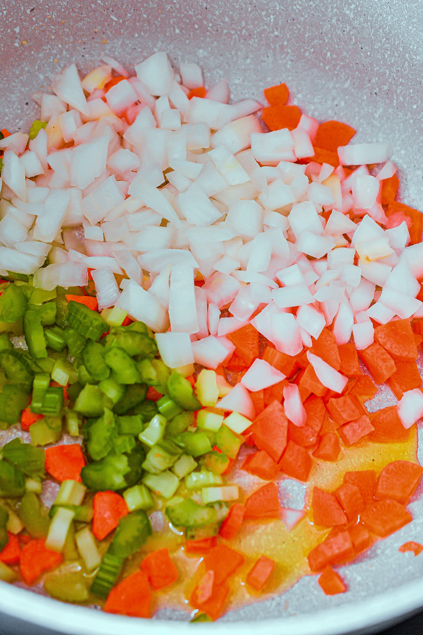 Add the celery, onion, and carrots to the pot, and saute until becoming tender.