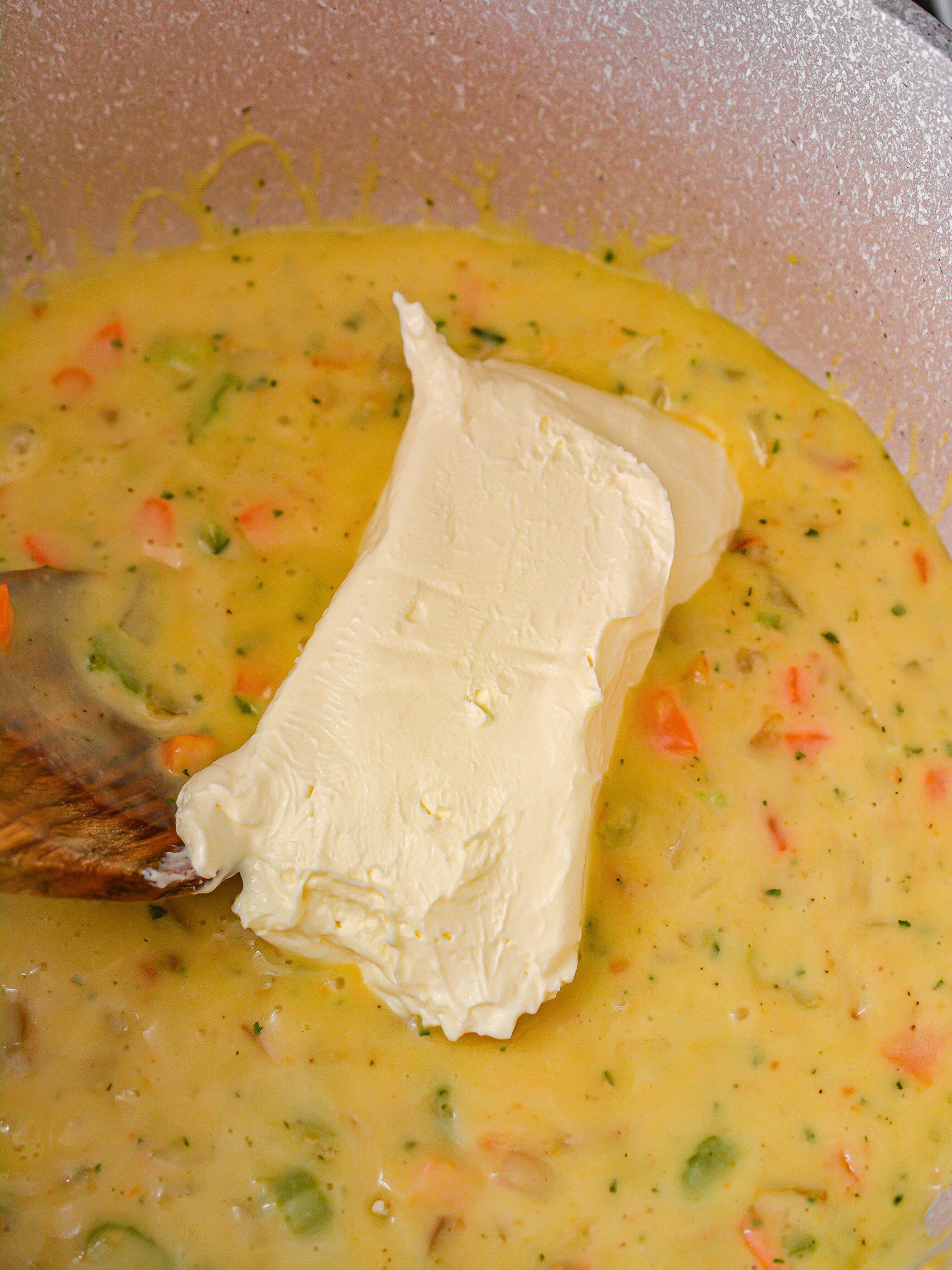 Add the cream cheese to the pot and stir until the cheese is completely melted.