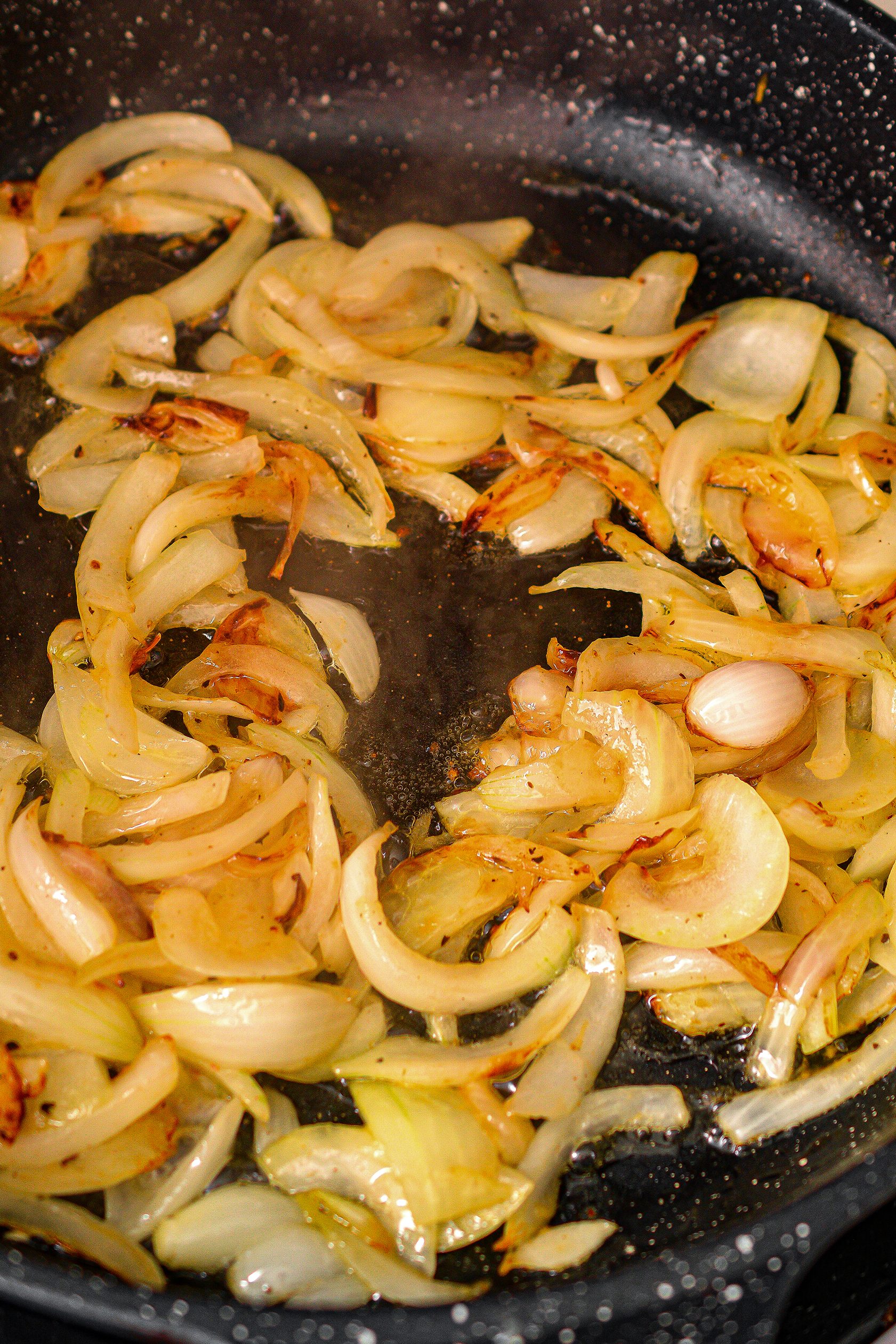 Over medium heat on the stove, melt the butter and add the onions. Saute until the onions are softened.
