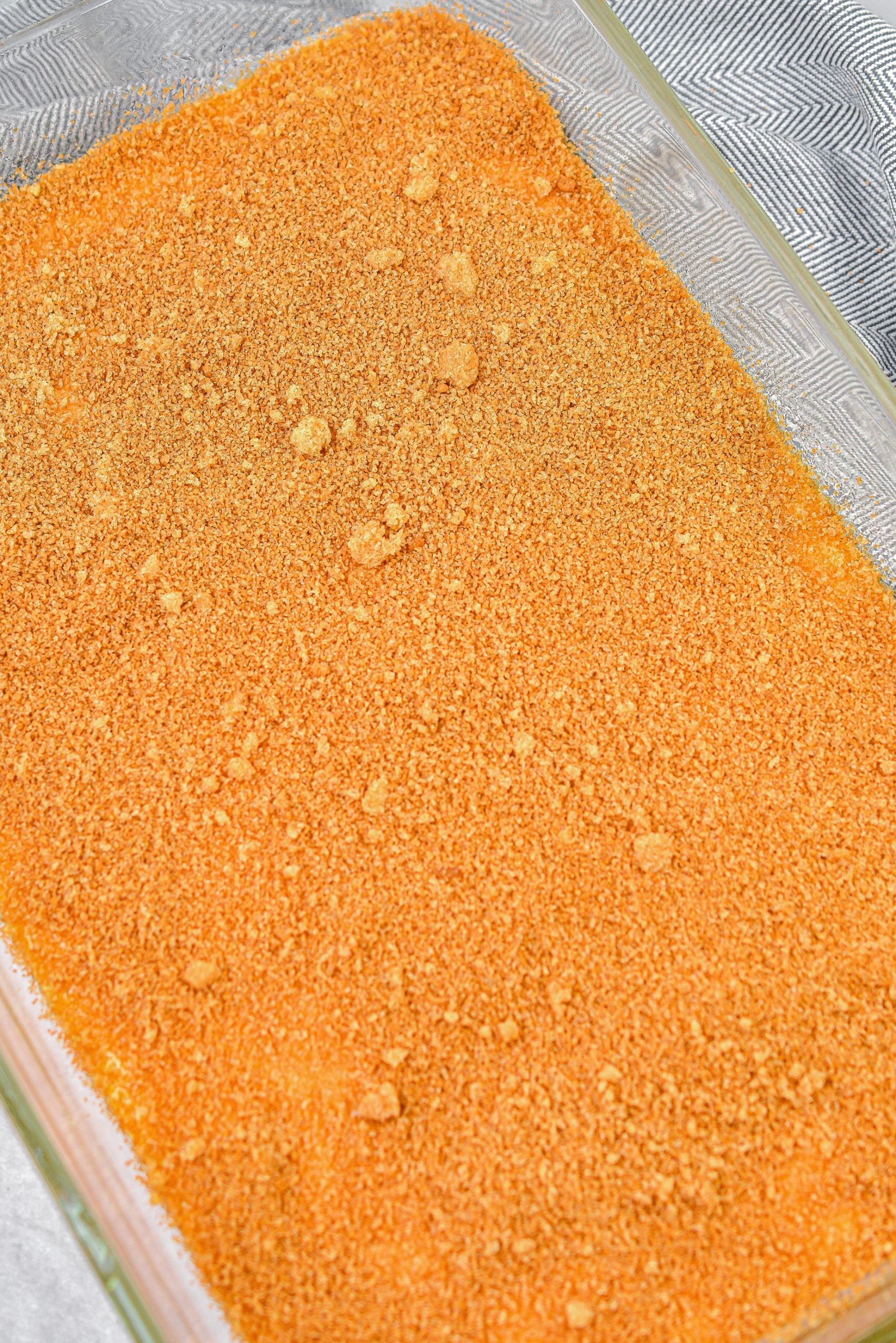 Sprinkle the cinnamon-sugar mixture over the cake batter in the casserole dish.