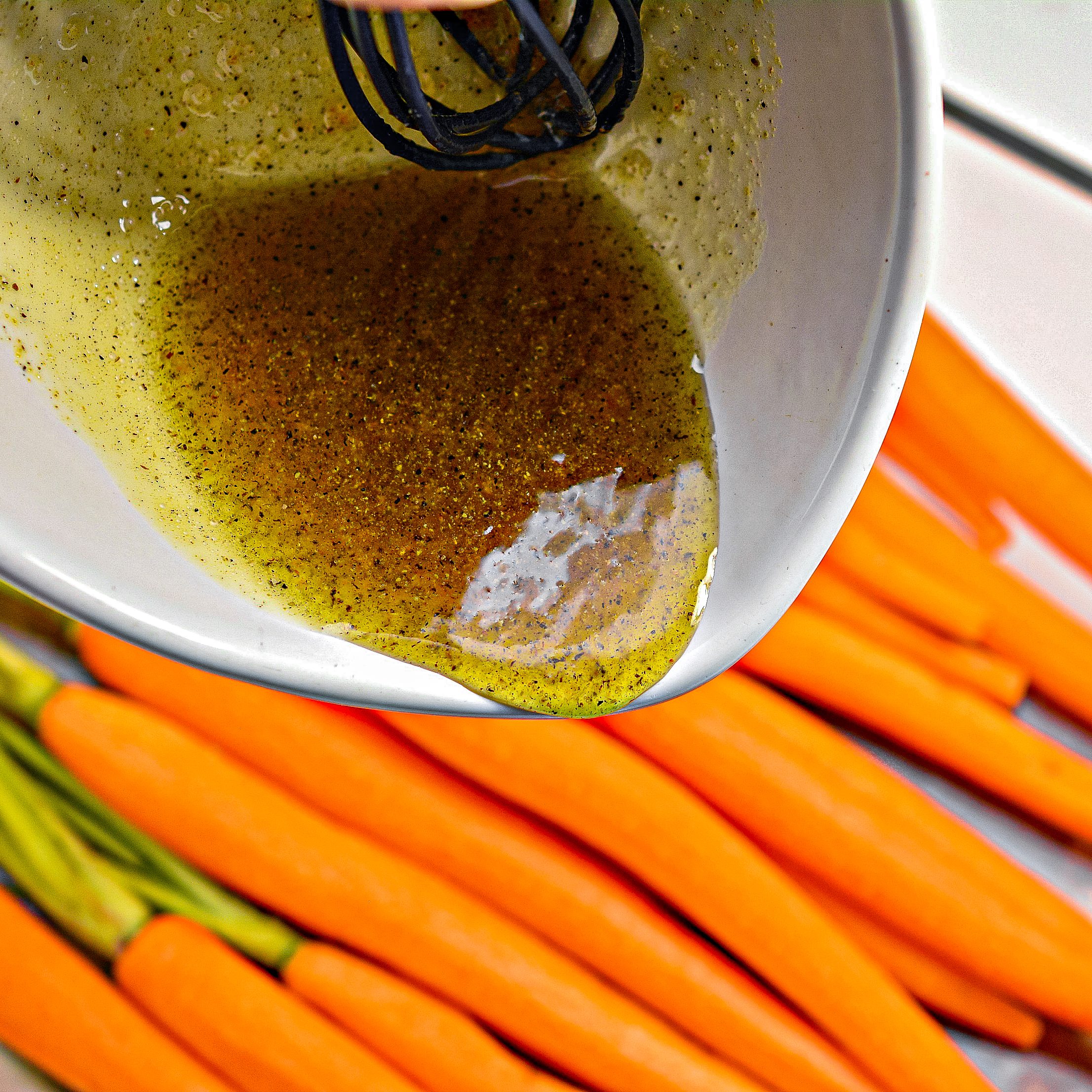 Pour the mixture over the carrots in the dish, and toss to coat well.
