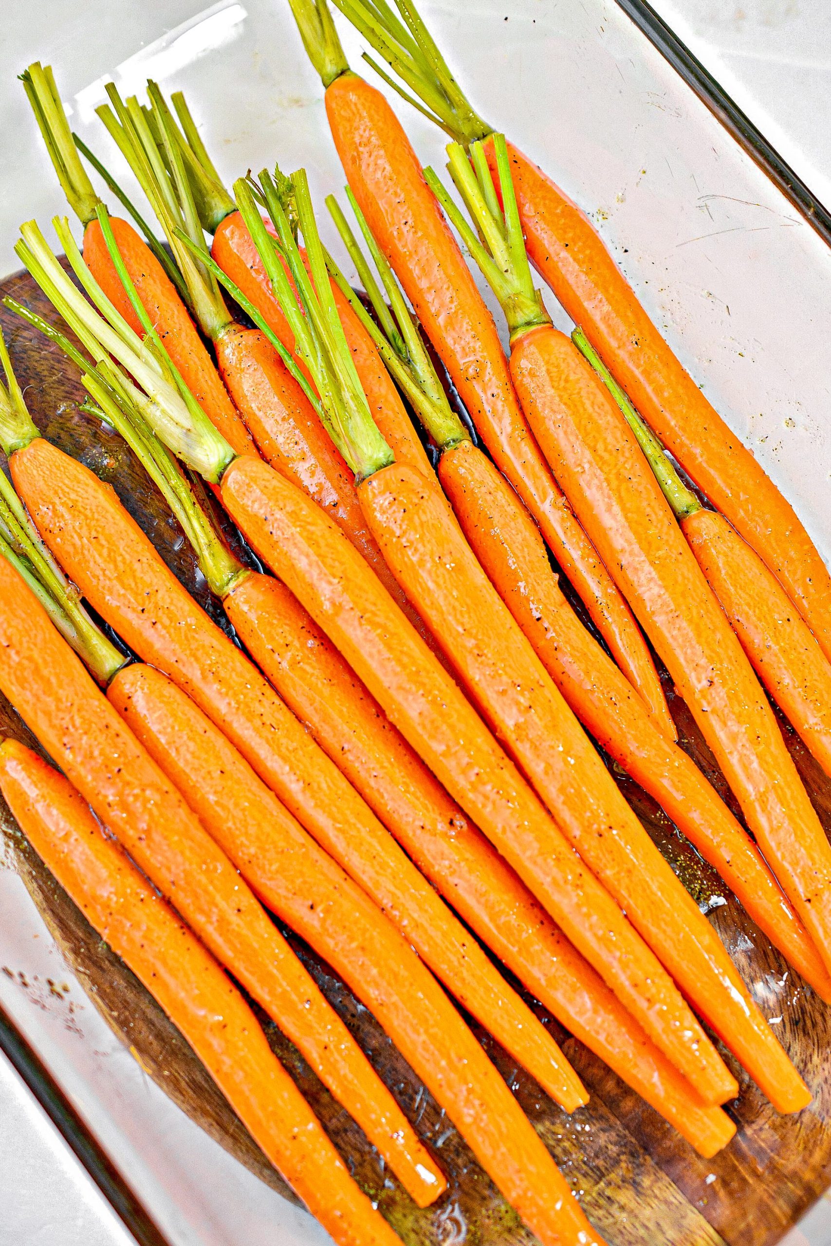 Pour the mixture over the carrots in the dish, and toss to coat well.