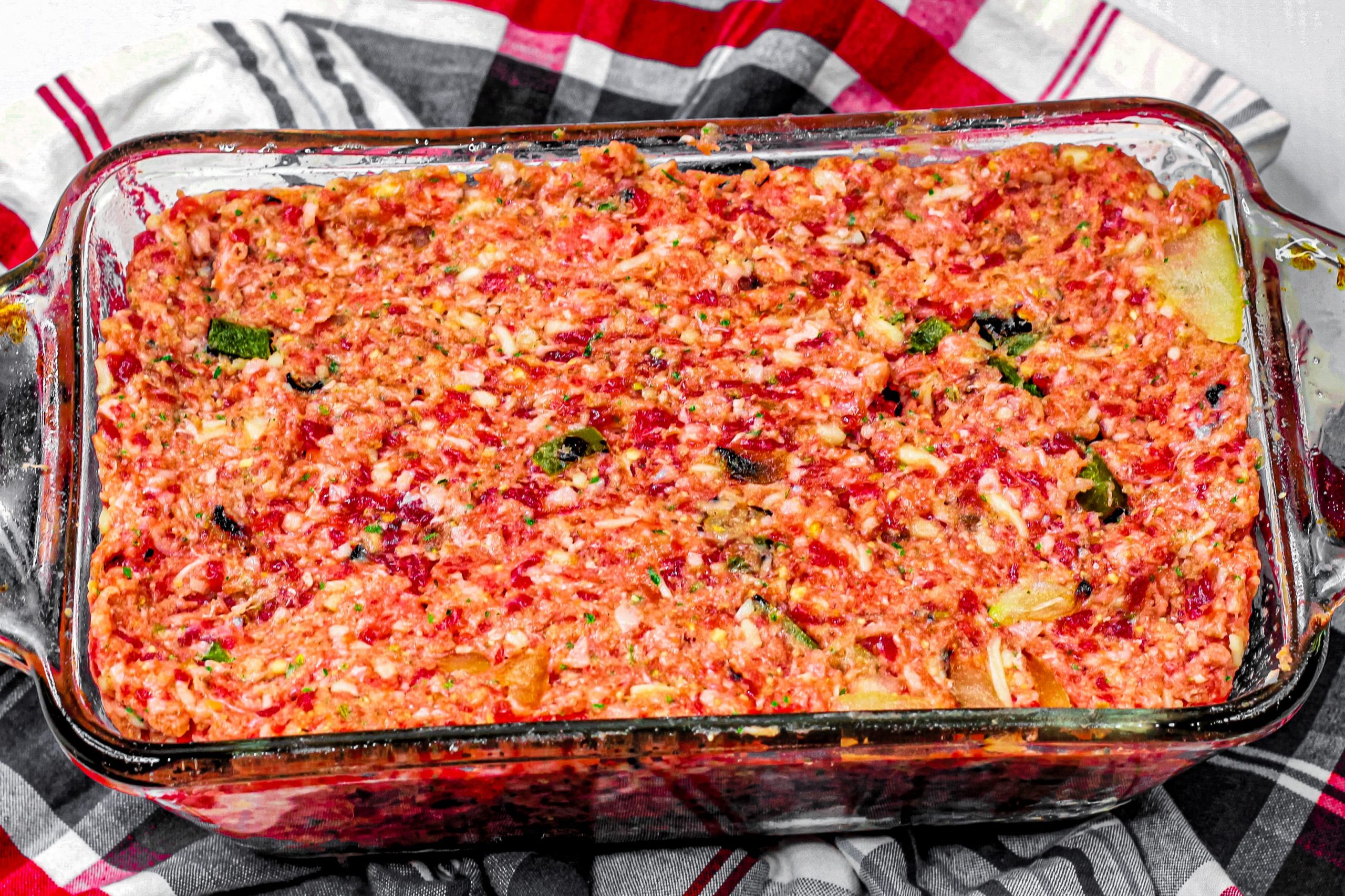 Place the meatloaf mixture into a loaf pan, press to evenly distribute the meatloaf mixture.