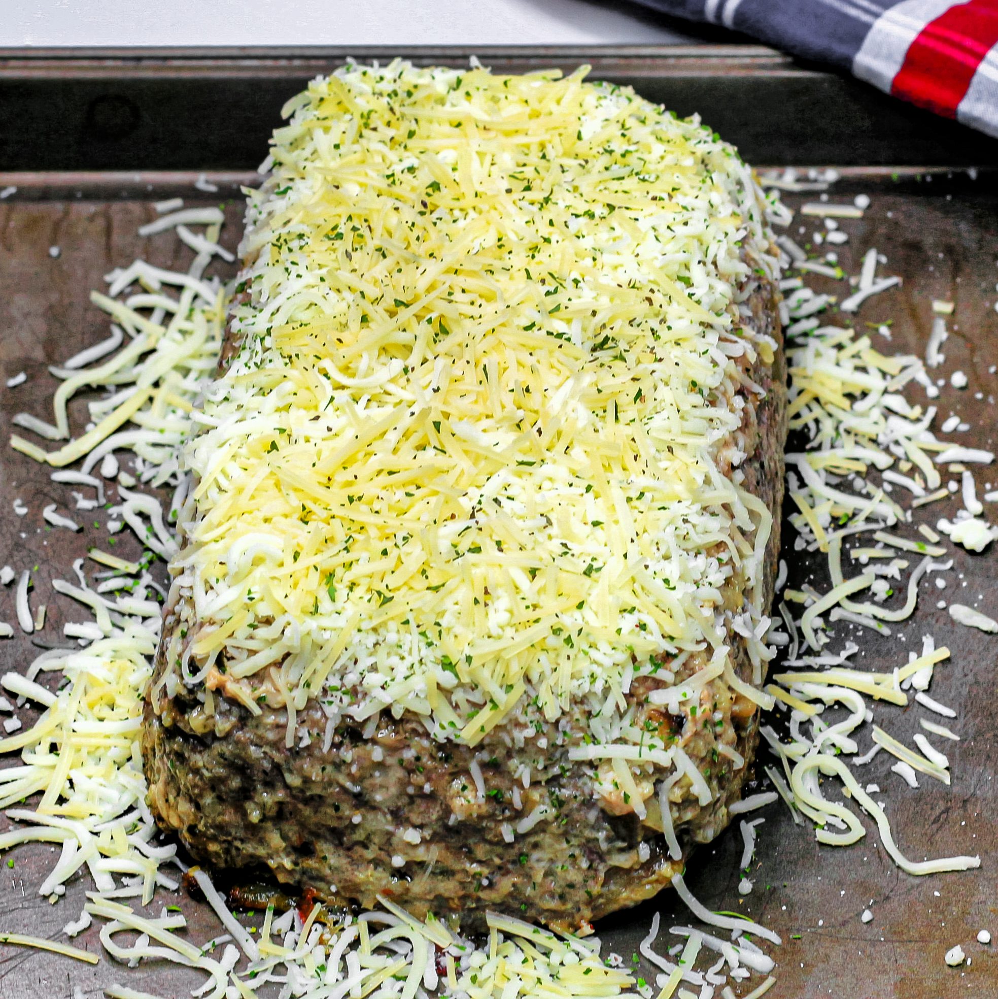 Remove from the oven and top with the remaining cheese and sprinkle a little dry basil over the top.