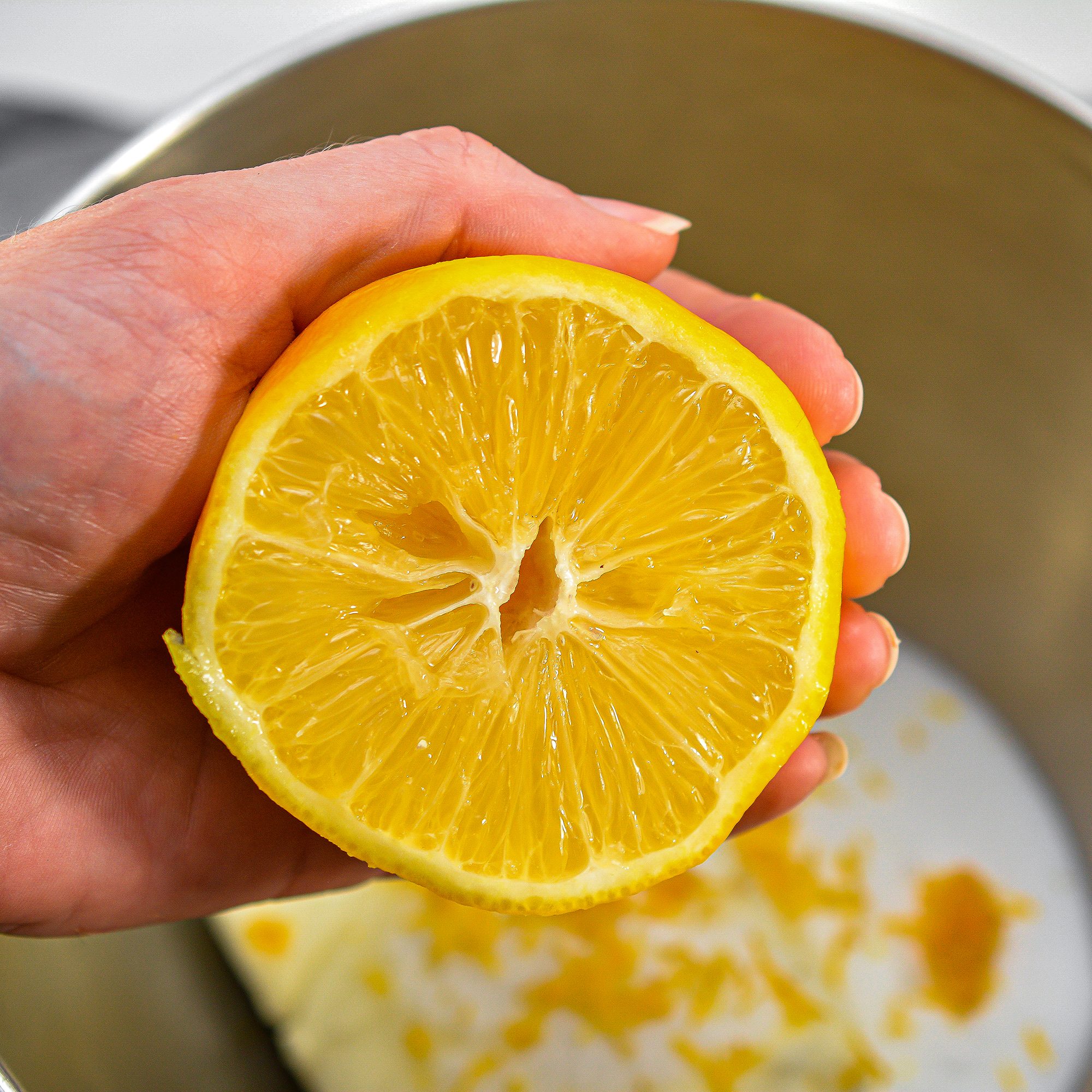In a mixing bowl, combine the cream cheese, ½ cup of sugar, lemon juice, and zest and vanilla extract. Beat until smooth.