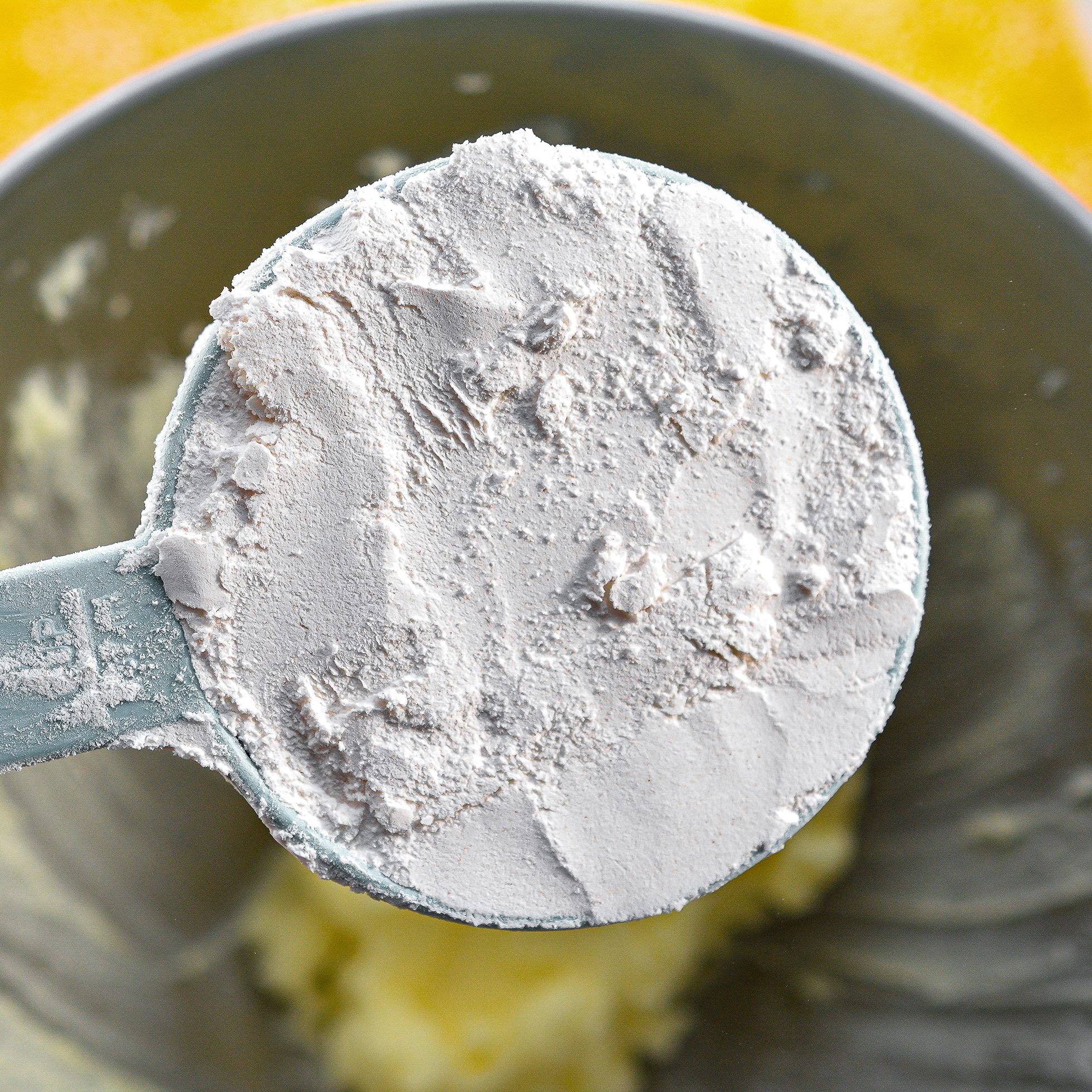 Mix in the flour, baking powder, eggs, lemon juice, and 1 tsp vanilla. Beat on high until well combined.