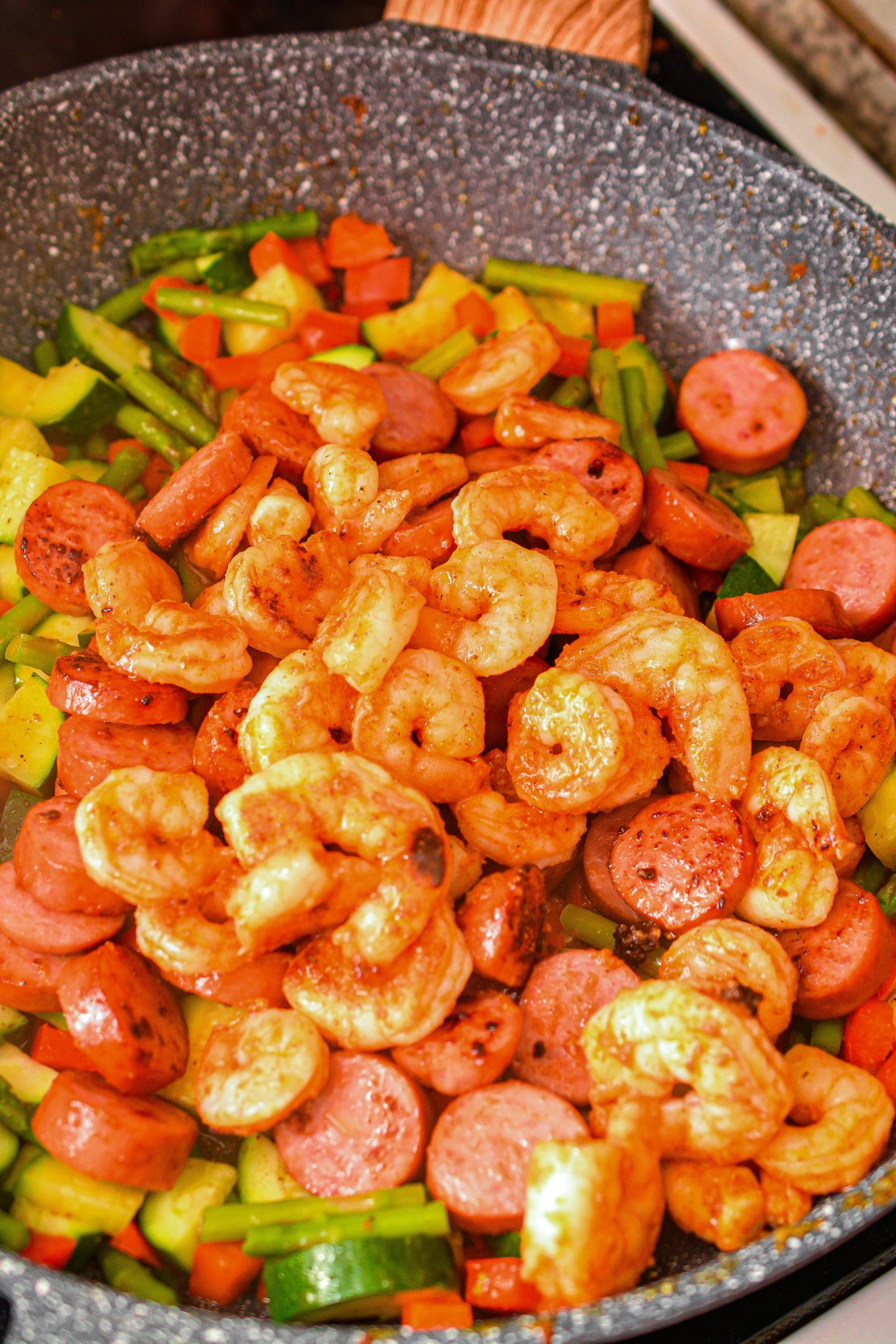 Stir the shrimp and sausage back in, and serve topped with parsley and red pepper flakes to taste.